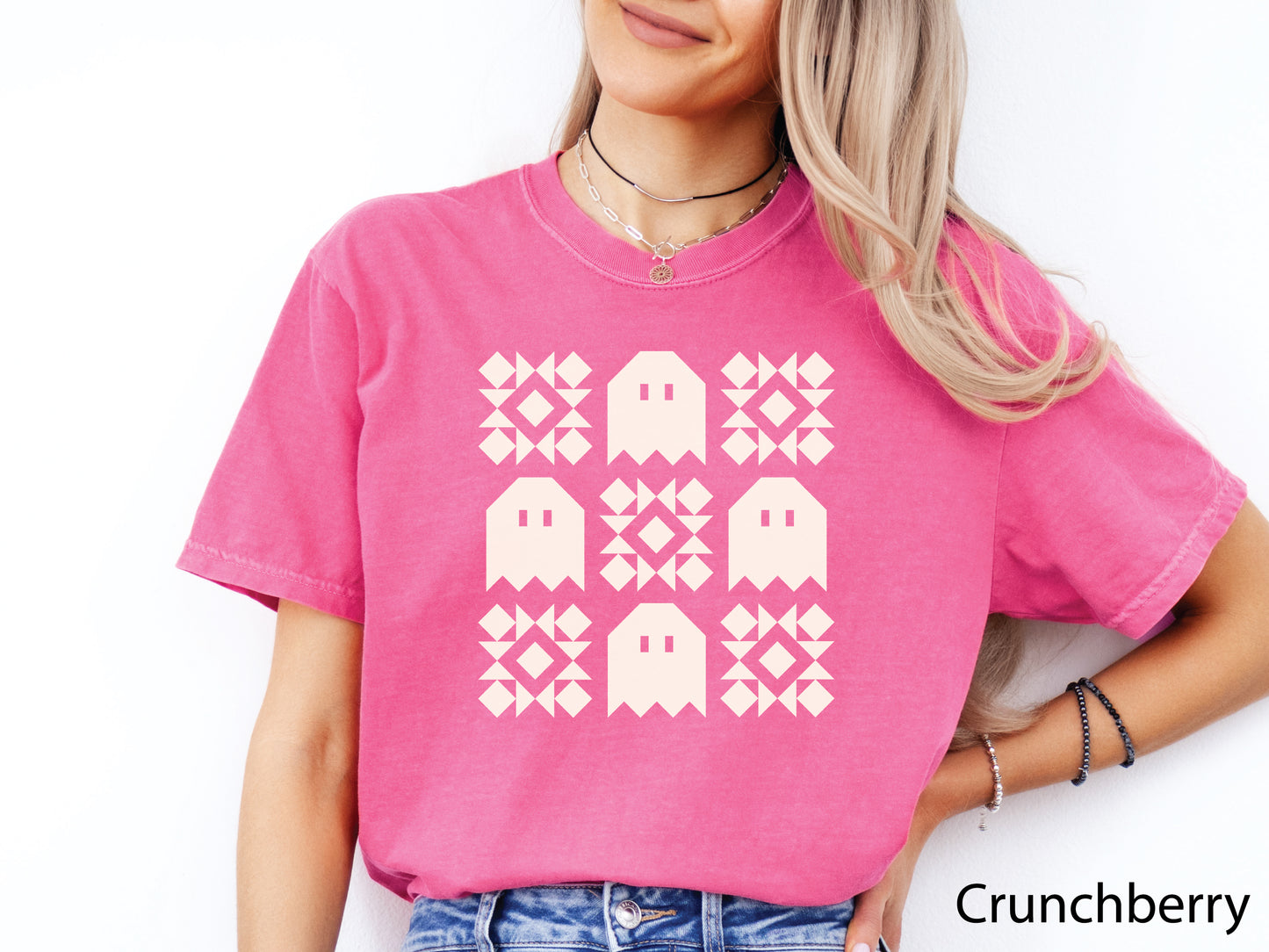 Halloween quilt t-shirt in Comfort Colors Crunchberry (bright pink) with spooky ghost quilt blocks in a grid design—fun fall gift for quilters.