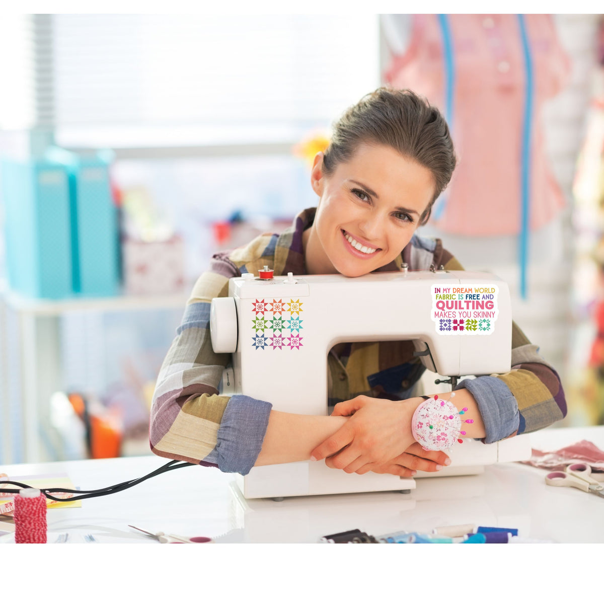 In My Dream World vinyl sticker featuring the funny saying, “In my dream world, fabric is free and quilting makes you skinny,” with colorful quilt blocks.