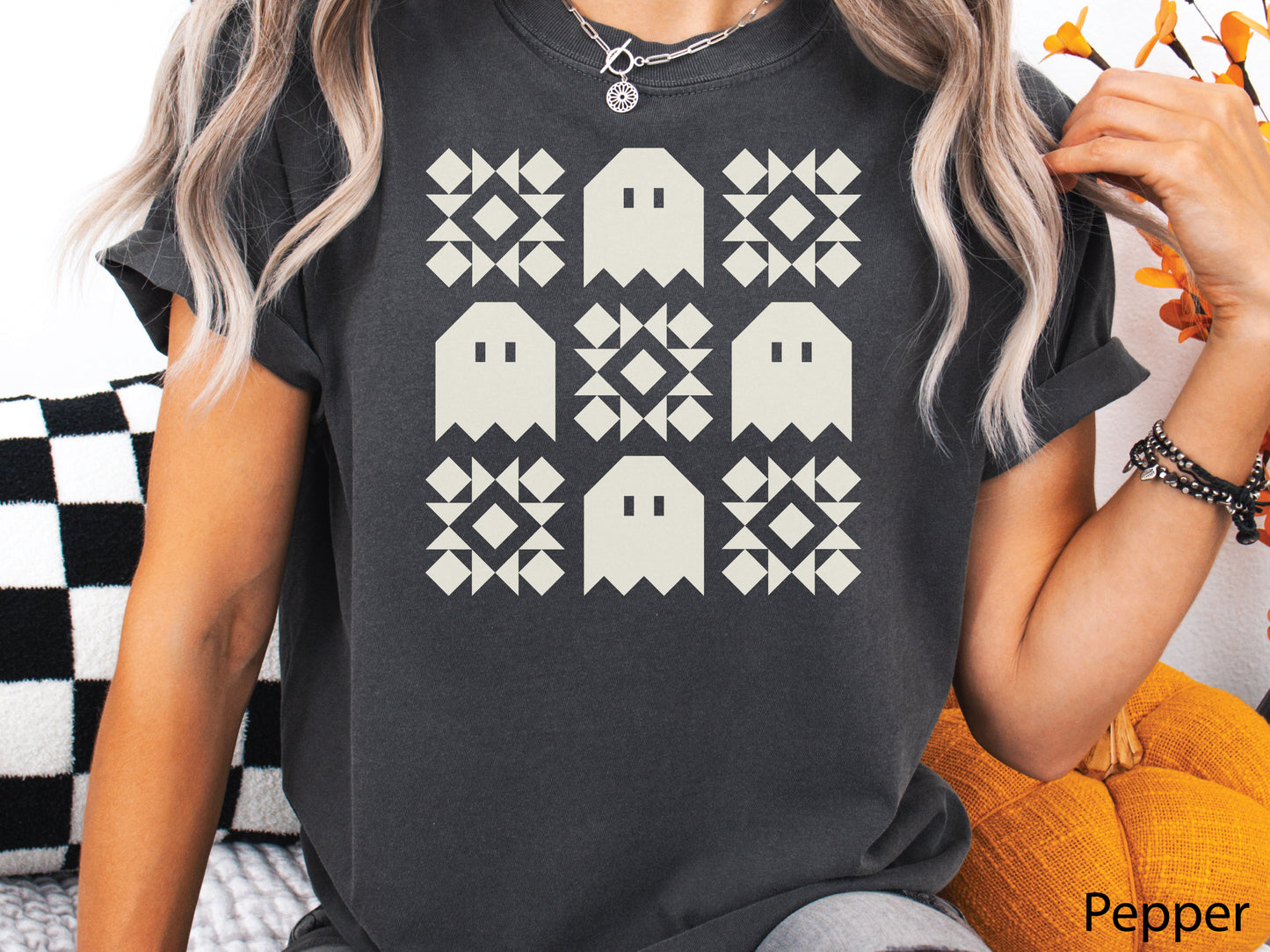 Halloween quilt t-shirt in Comfort Colors Pepper orange with spooky ghost quilt blocks in a grid design—fun fall gift for quilters.