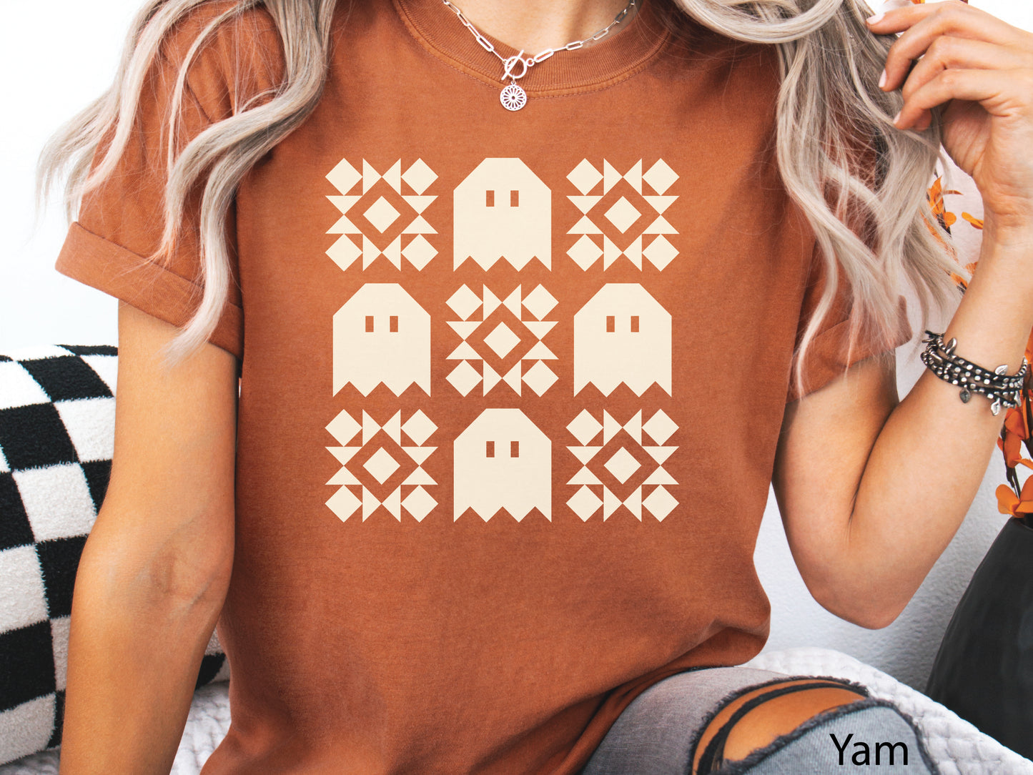Halloween quilt t-shirt in Comfort Colors Yam orange with spooky ghost quilt blocks in a grid design—fun fall gift for quilters.