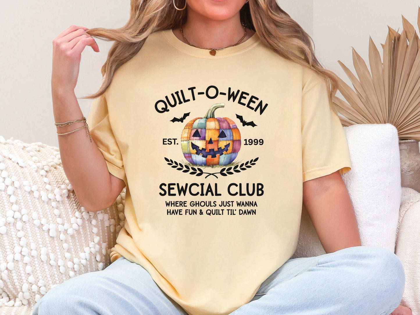 Quilt-O-Ween Sewcial Club shirt from Bee Inspired Tees, designed in Lt Yellow (Butter) with a colorful patchwork jack-o’-lantern, bats, and playful Halloween typography—perfect gift for quilters.