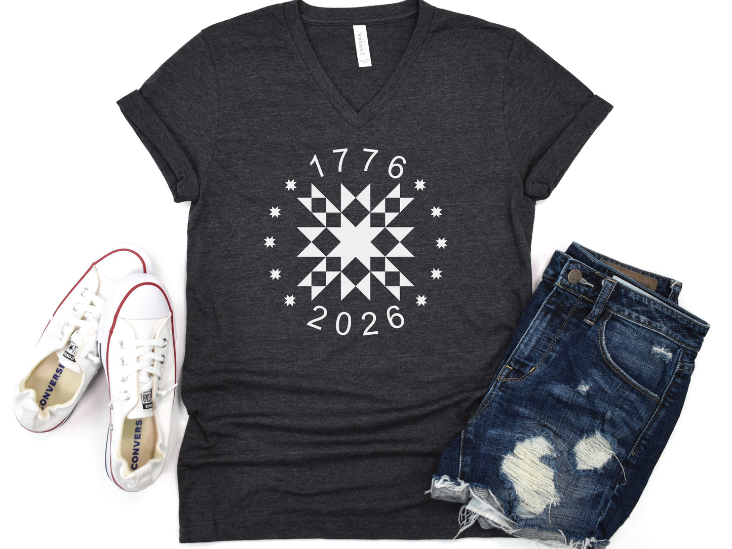 Patriotic quilting t-shirt in navy featuring a white star quilt block with surrounding stars and the years 1776–2026, celebrating America’s 250th Anniversary.