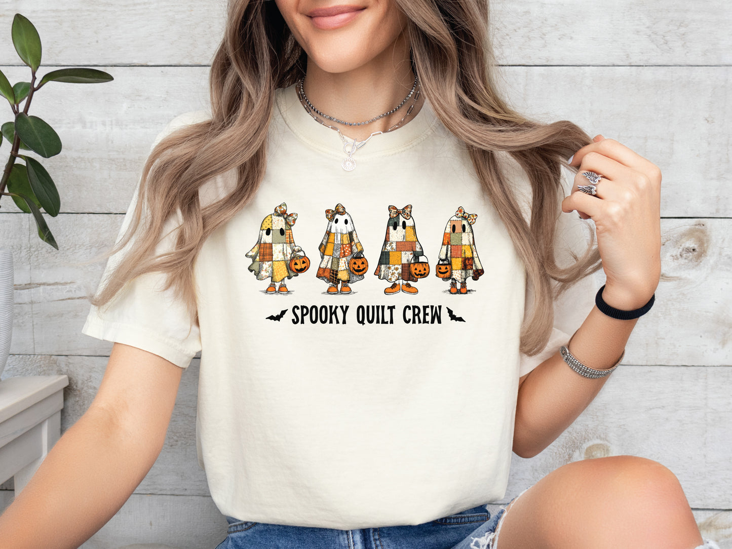 Spooky Quilt Crew Comfort Colors t-shirt from Bee Inspired Tees in Ivory, featuring four patchwork ghosts with jack-o’-lanterns and bold text—fun Halloween gift for quilters.