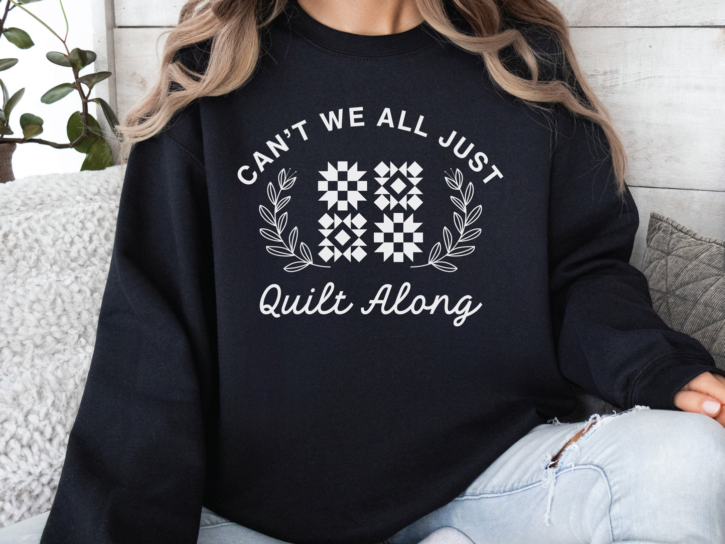 Cozy quilt-themed soft crew Black sweatshirt with the phrase “Can’t We Just All Quilt Along,” perfect gift for a quilter, ideal for sewing days, quilt retreats, and craft fairs.