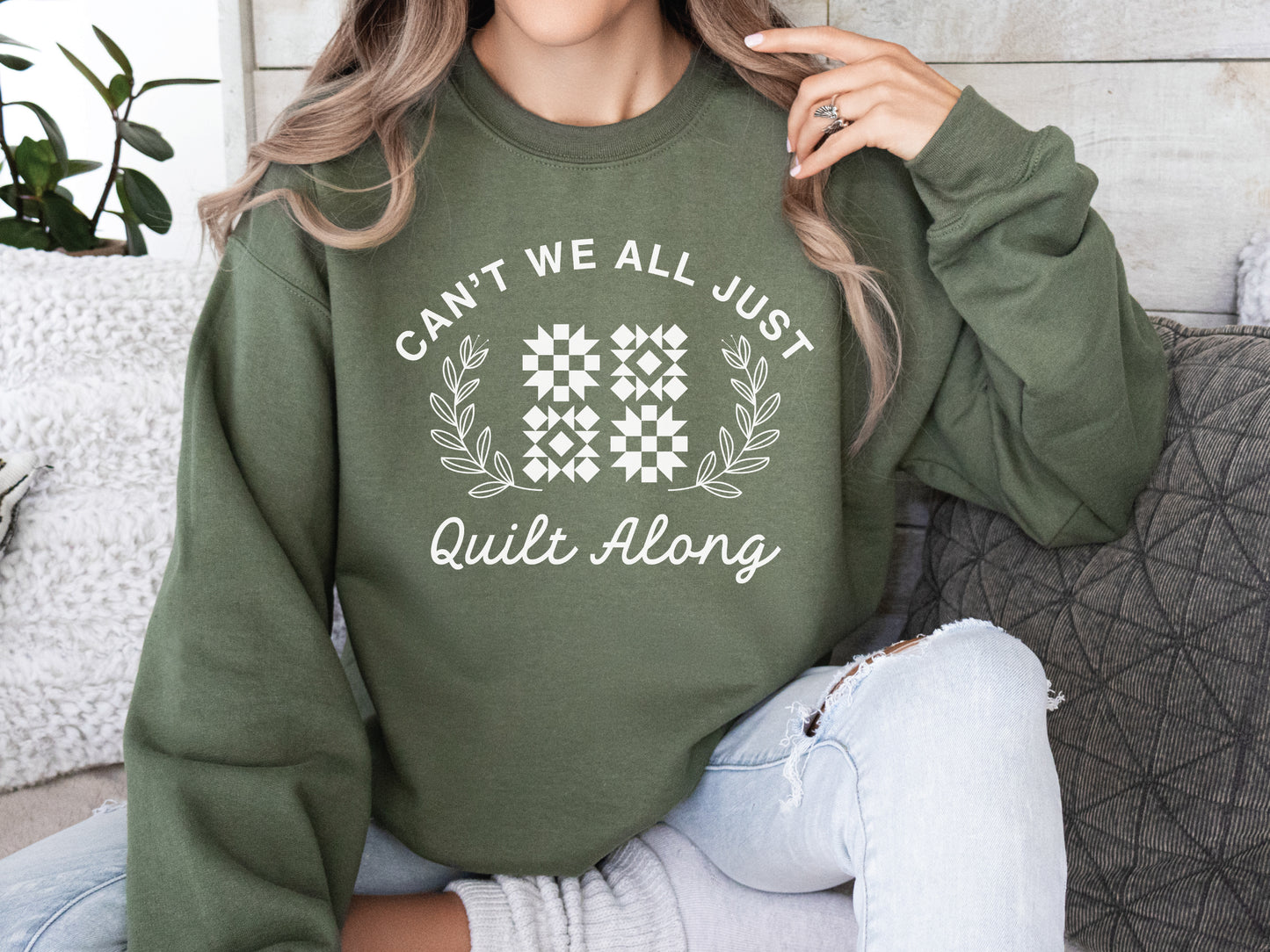Cozy quilt-themed soft crew Military Green sweatshirt with the phrase “Can’t We Just All Quilt Along,” perfect gift for a quilter, ideal for sewing days, quilt retreats, and craft fairs.