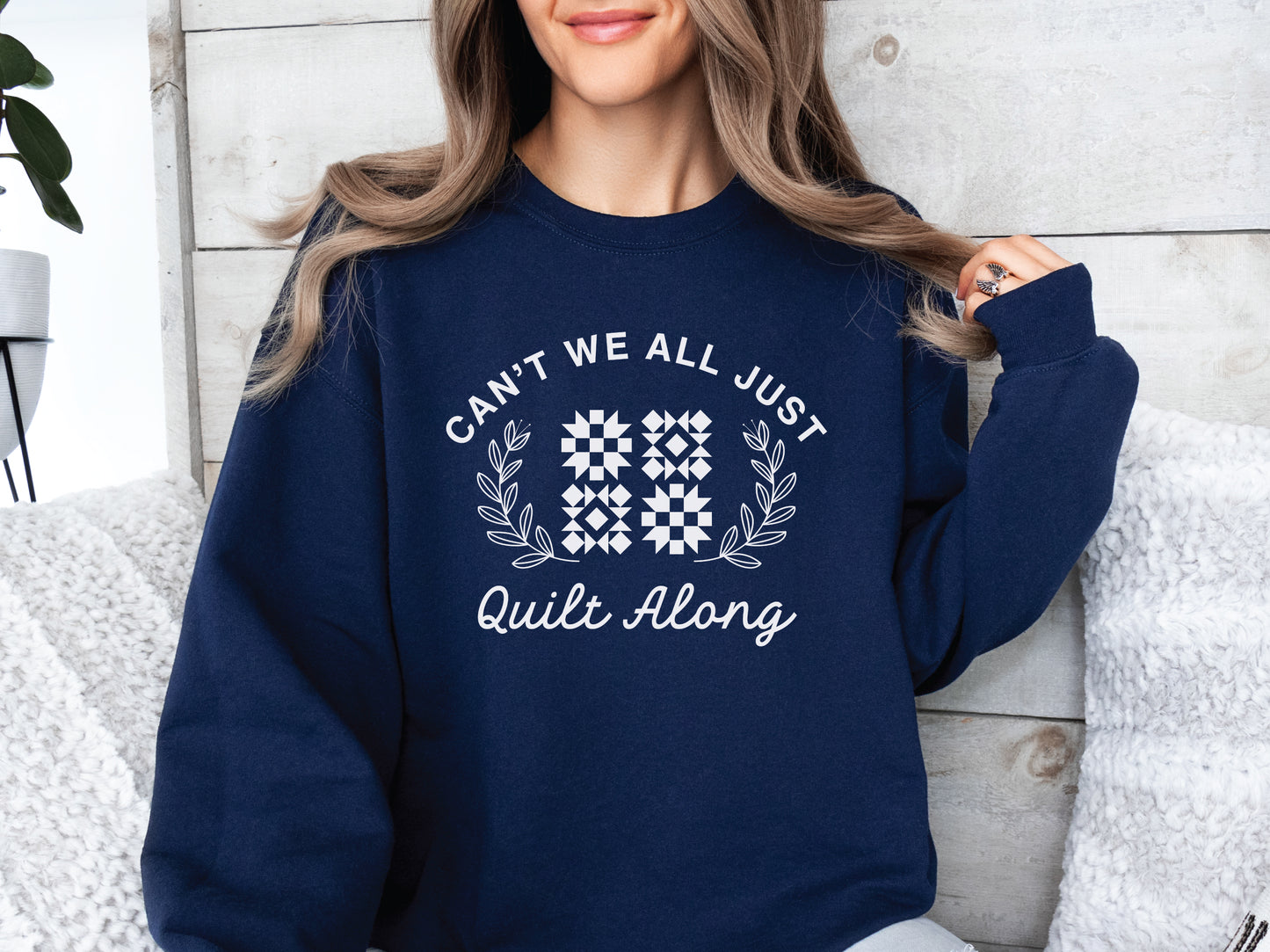 Cozy quilt-themed soft crew Navy sweatshirt with the phrase “Can’t We Just All Quilt Along,” perfect gift for a quilter, ideal for sewing days, quilt retreats, and craft fairs.