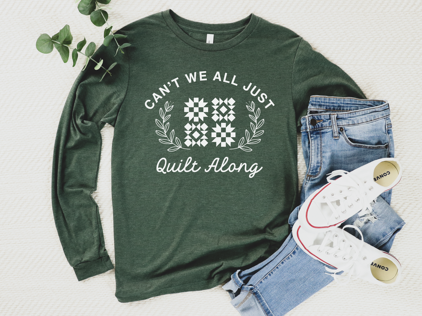 Cozy quilt-themed long sleeve Forest t-shirt with the phrase “Can’t We Just All Quilt Along,” perfect gift for a quilter, ideal for sewing days, quilt retreats, and craft fairs.
