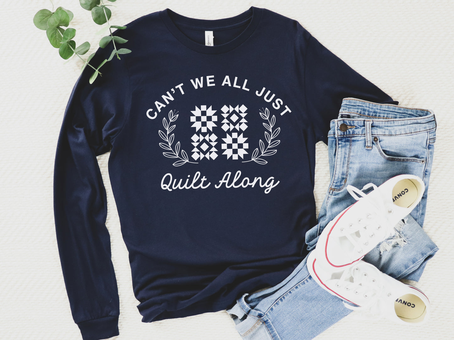 Cozy quilt-themed long sleeve Navy t-shirt with the phrase “Can’t We Just All Quilt Along,” perfect gift for a quilter, ideal for sewing days, quilt retreats, and craft fairs.