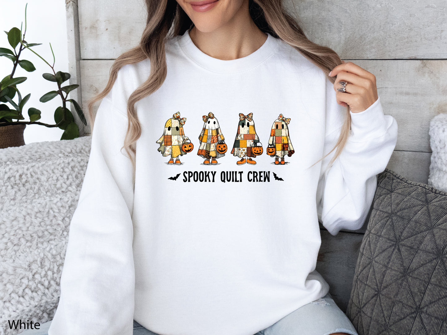 Spooky Quilt Crew sweatshirt from Bee Inspired Tees in the color White, featuring four patchwork ghosts with jack-o’-lanterns and bold text—fun Halloween gift for quilters.