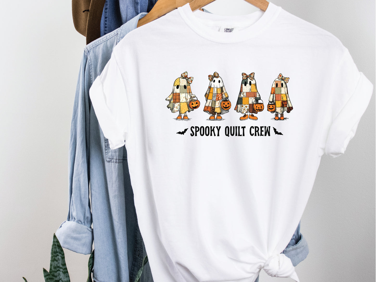 Spooky Quilt Crew Comfort Colors t-shirt from Bee Inspired Tees in White, featuring four patchwork ghosts with jack-o’-lanterns and bold text—fun Halloween gift for quilters.