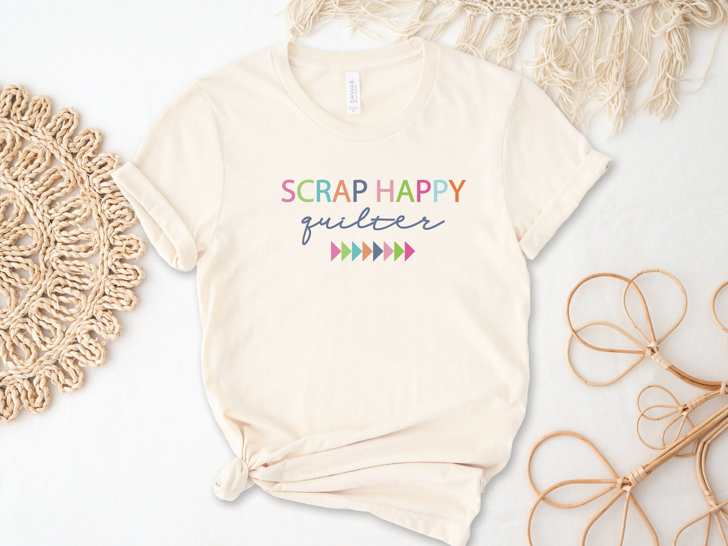 A fun and colorful "Scrap Happy Quilter" t-shirt. The colors included are pink, aqua, orange, and navy.