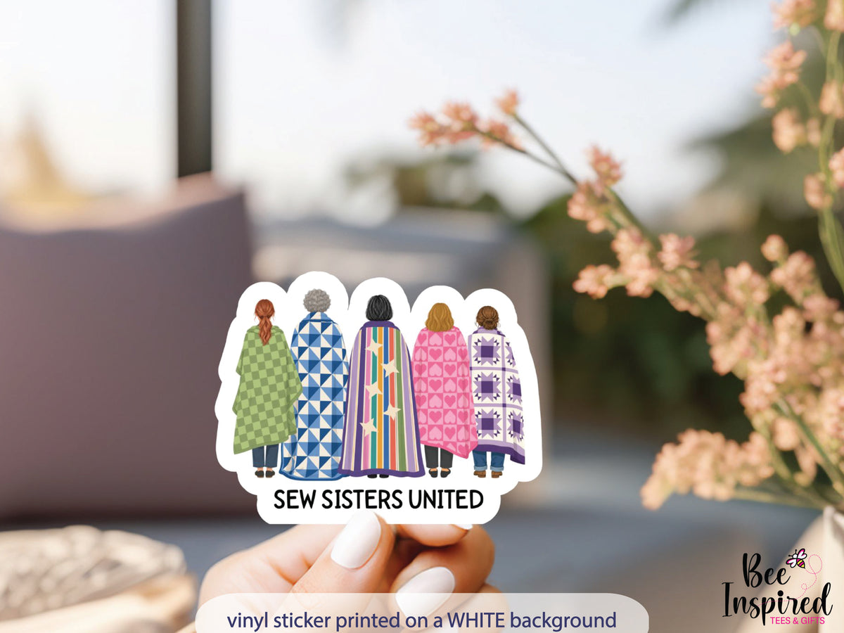 Sew Sisters United sticker featuring five quilters wrapped in colorful quilts. A fun friendship gift for quilting friends, guild members, and retreat buddies.