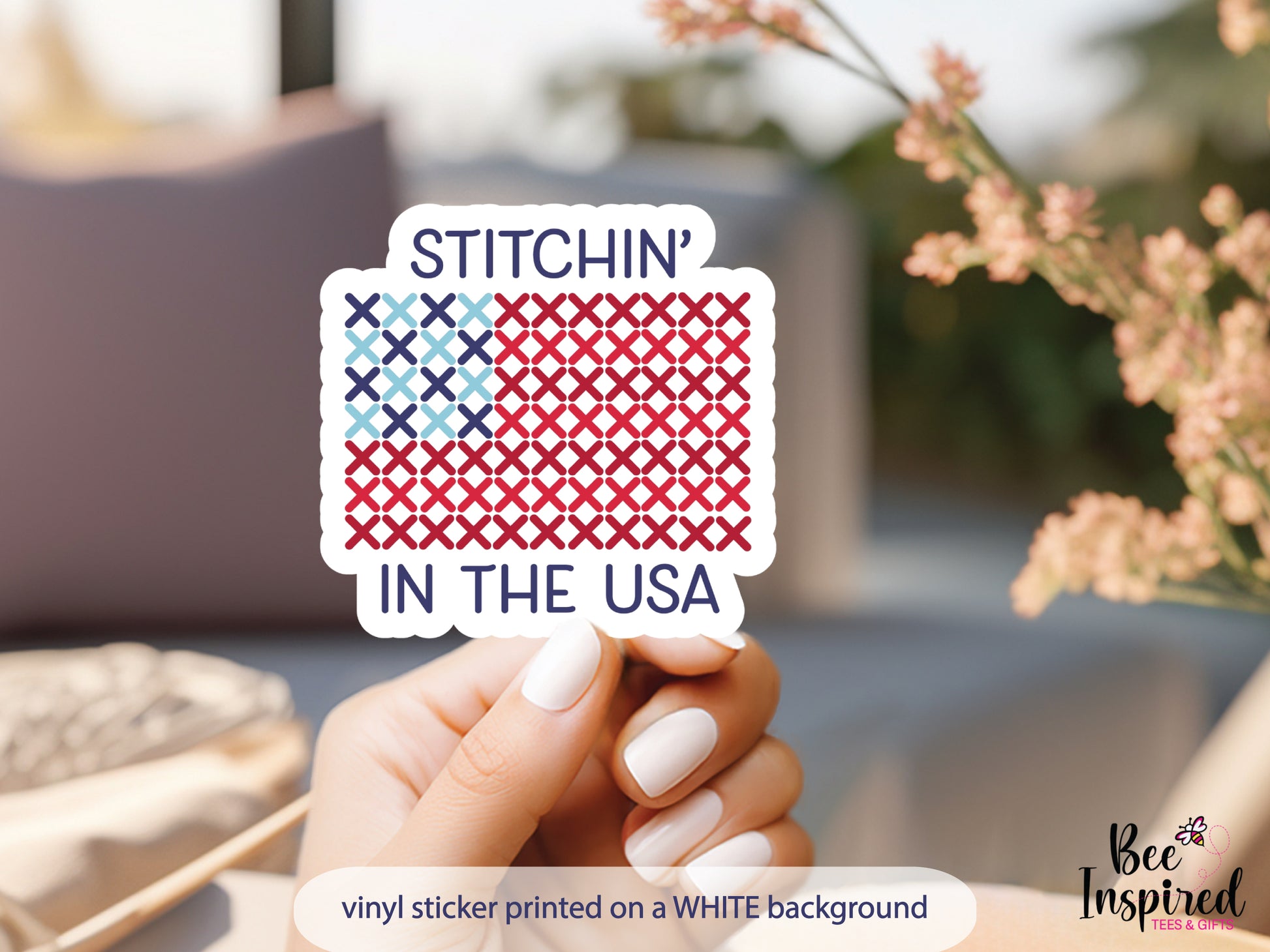Patriotic “Stitchin’ In The USA” vinyl sticker with American flag stitching design on a white background, perfect for sewing, cross stitch, and needlepoint lovers celebrating America’s 250th.
