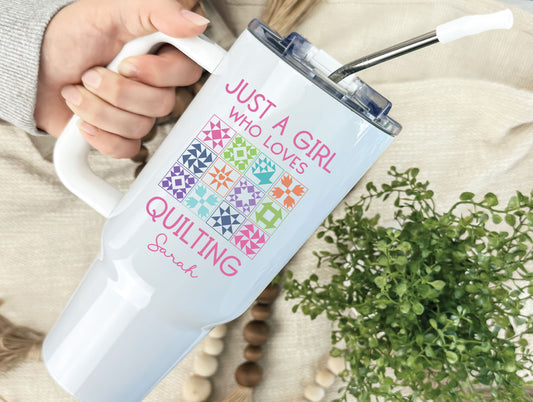40oz personalized tumbler featuring 40oz stainless steel tumbler featuring “Just a Girl Who Loves Quilting” with colorful quilt blocks; personalized with your name and individually boxed for gifting.