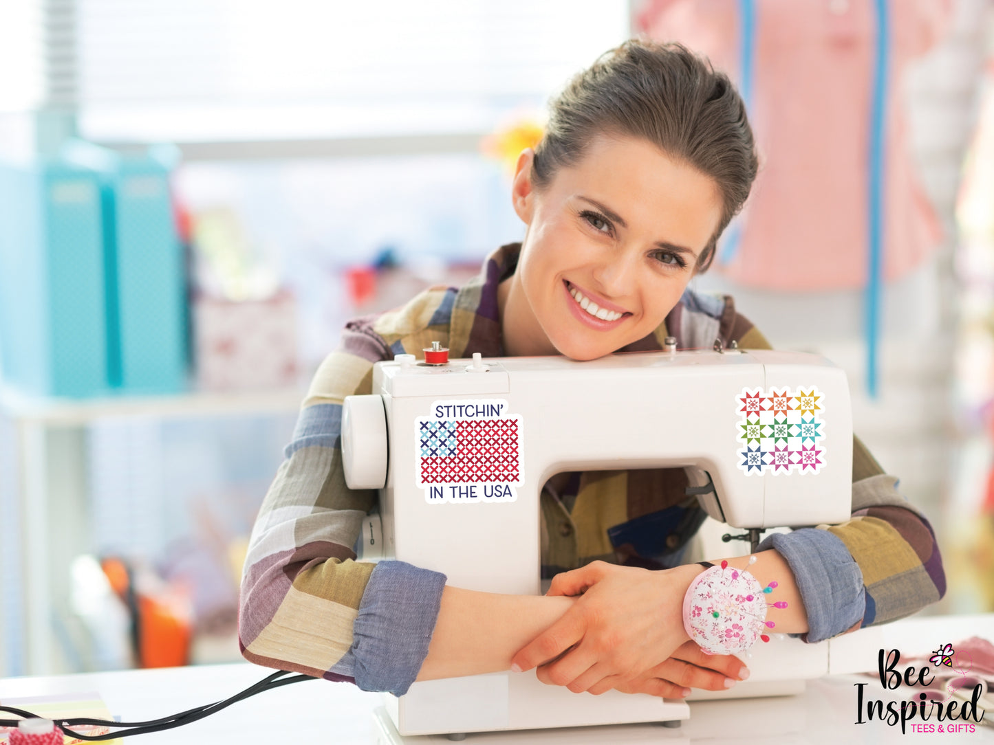 Patriotic “Stitchin’ In The USA” vinyl sticker with American flag stitching design on a white background, perfect for sewing, cross stitch, and needlepoint lovers celebrating America’s 250th.