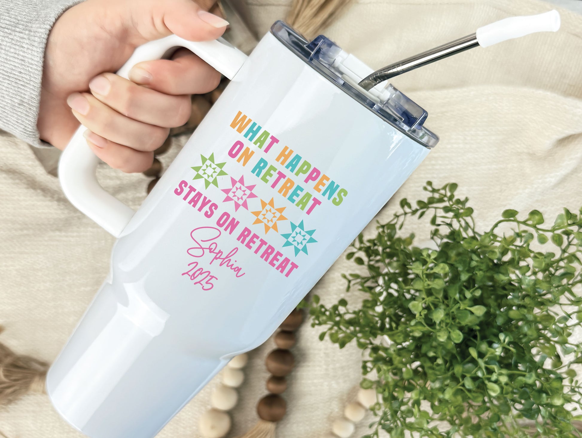 40oz stainless steel tumbler with “What Happens on Retreat Stays on Retreat,” colorful quilt blocks, and personalized name and year; a fun keepsake for quilters.