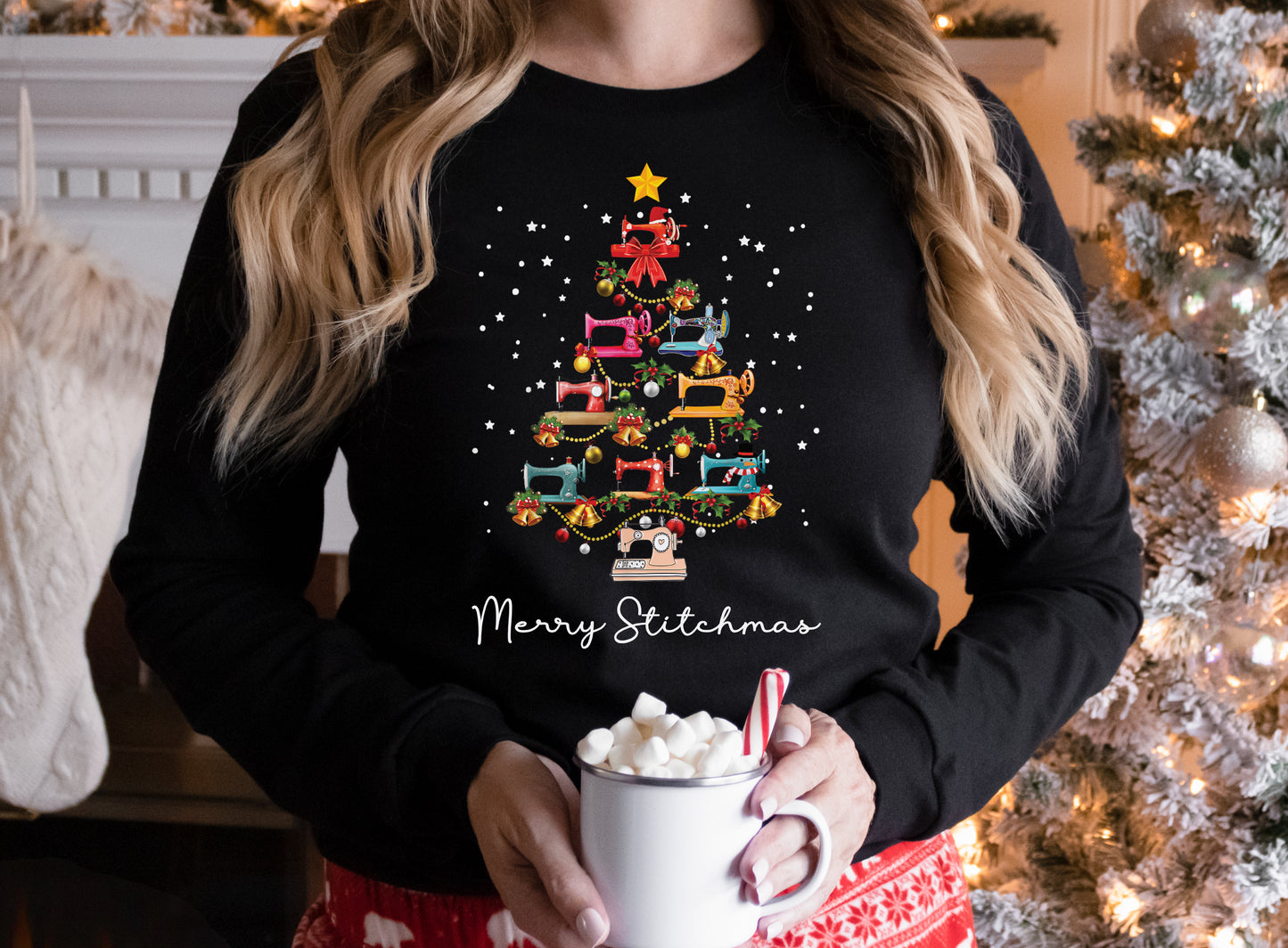 Black long sleeve shirt with a Christmas tree made of colorful sewing machines and the words “Merry Stitchmas” — festive holiday gift for quilters and sewists.