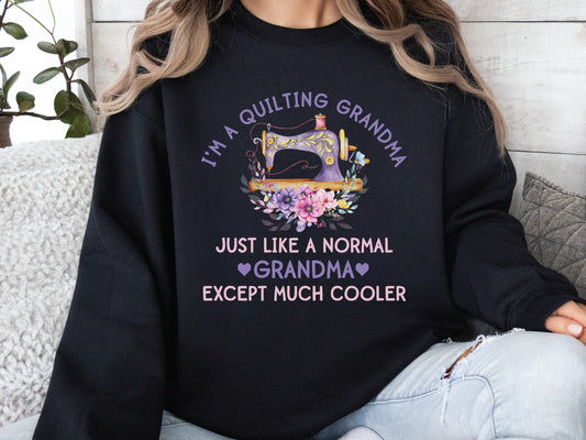 “I’m a Quilting Grandma” sweatshirt with floral sewing machine design and the phrase “Just Like a Normal Grandma Except Much Cooler.” Cozy gift for quilters from Bee Inspired Tees. 