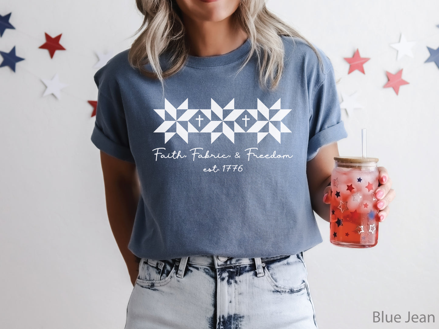 Blue t-shirt with Faith, Fabric & Freedom design featuring quilt star blocks with cross details, ideal for quilters and faith-based patriotic wear.