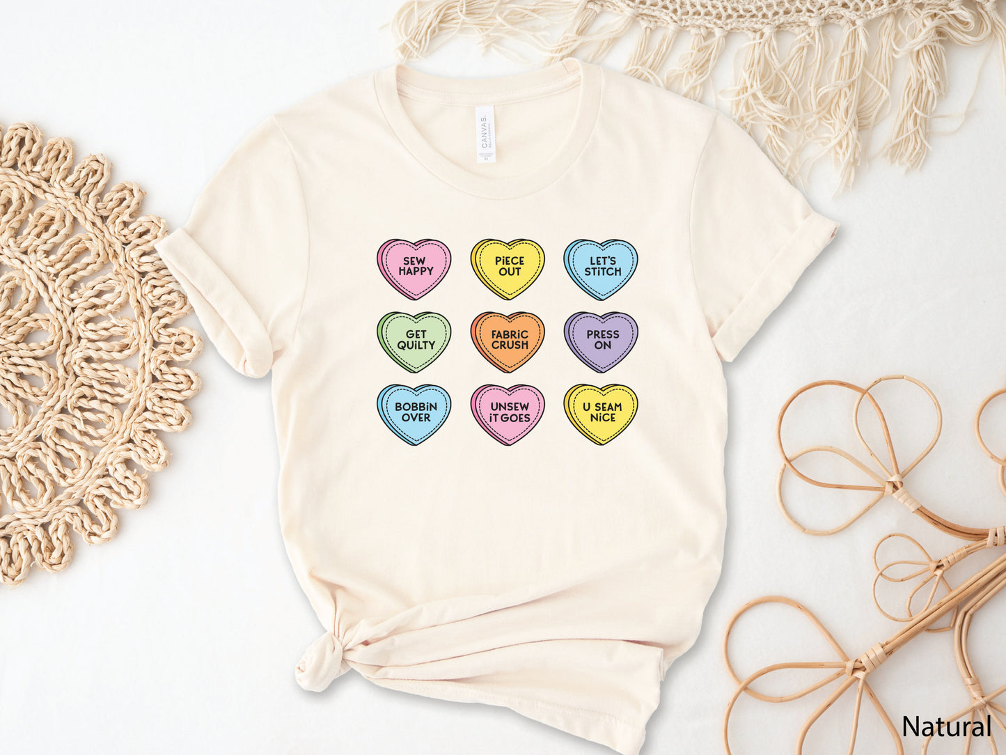Valentine’s Day t-shirt with pastel conversation hearts and sewing phrases like “Sew Happy” and “Fabric Crush,” perfect for quilters and sewers.