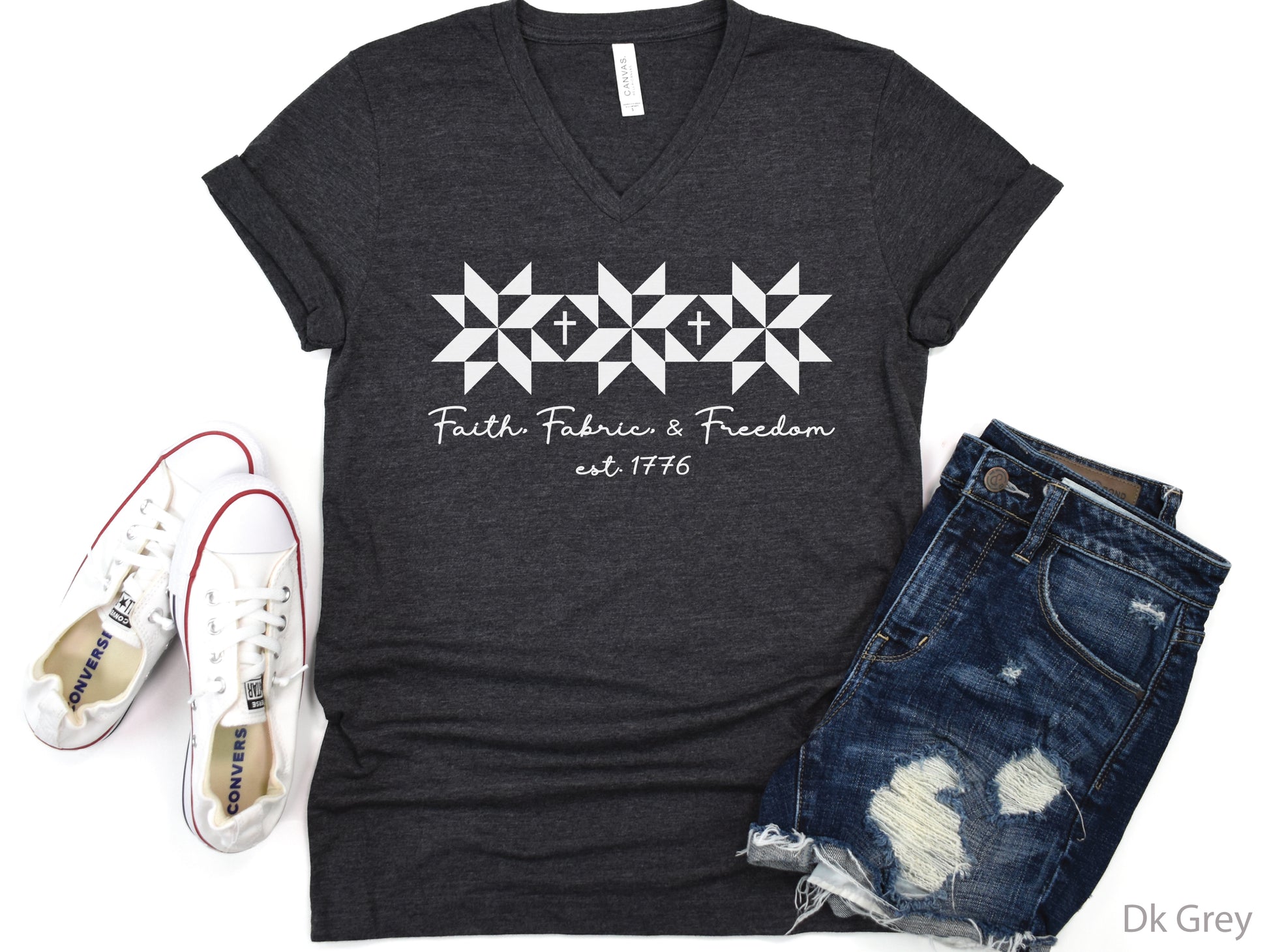 Faith, Fabric & Freedom patriotic v-neck t-shirt with quilt block stars and cross details. Perfect for quilters, sewists, and faith-based gifts.