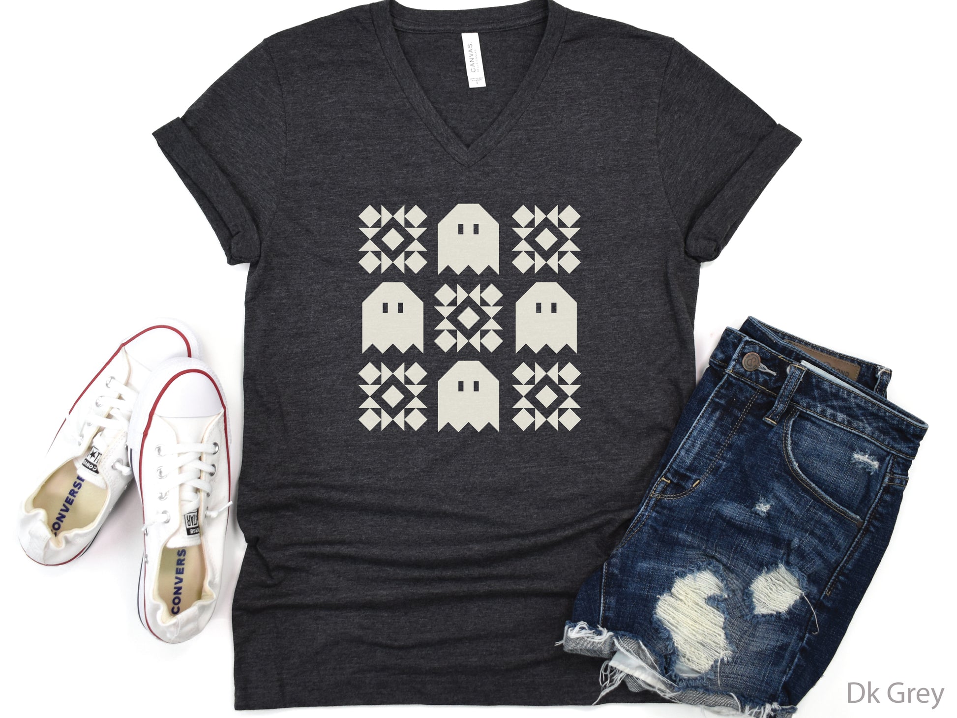 Soft Bella + Canva V-neck Halloween quilting t-shirt featuring a cream grid design with four spooky ghosts and five geometric quilt blocks. A customer favorite!