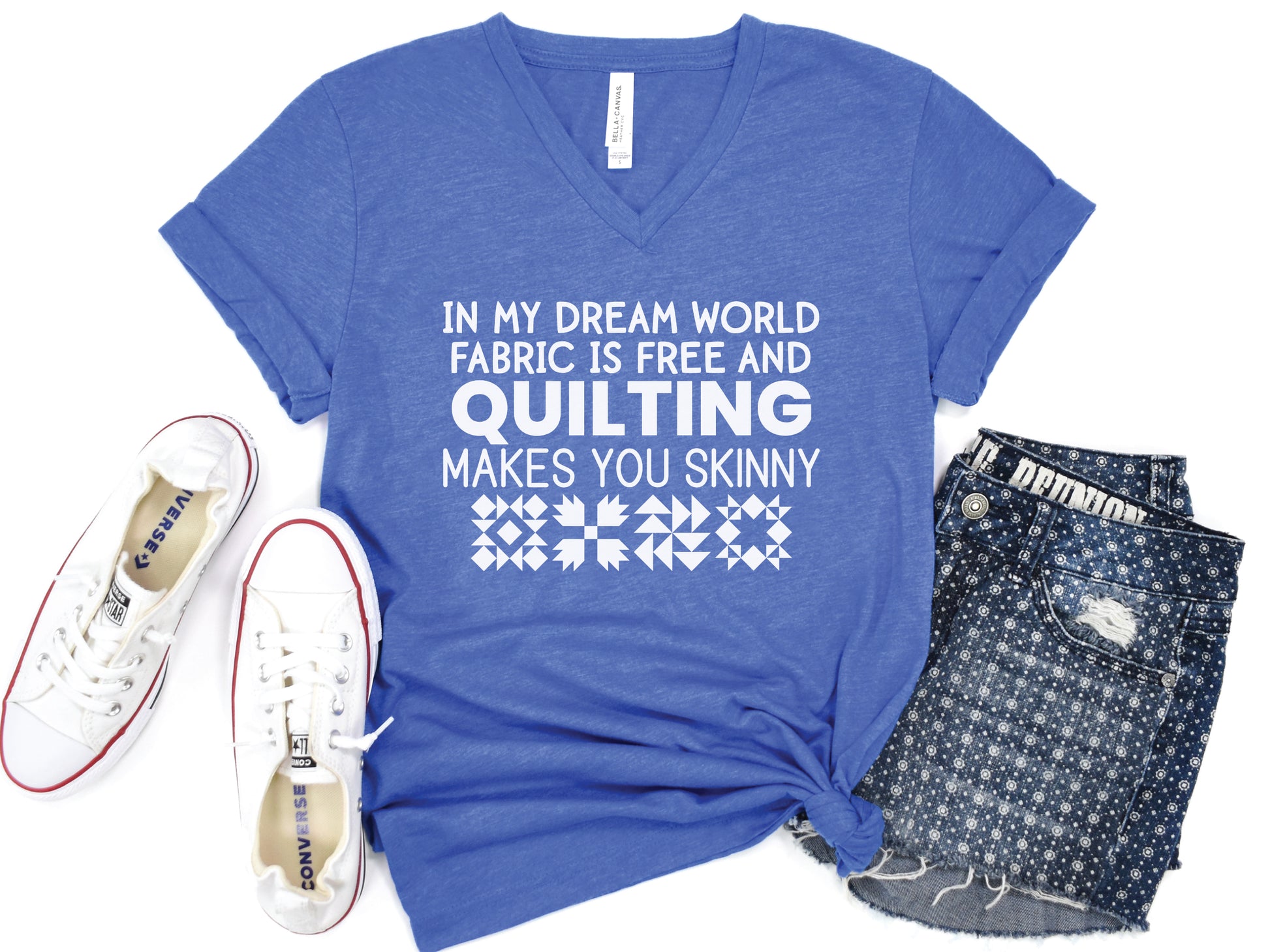 Quilting V-neck t-shirt with the humorous phrase “In My Dream World, Fabric Is Free and Quilting Makes You Skinny,” perfect for quilters and sewing retreats.