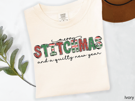 Festive Merry Stitchmas & a Quilty New Year t-shirt with red, green patchwork lettering—perfect holiday gift for quilters and sewists.