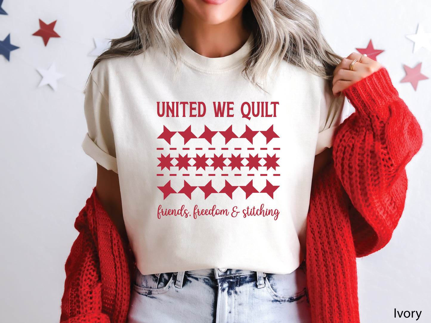 United We Quilt t-shirt with rows of friendship quilt blocks and the phrase Friends, Freedom & Stitching, a fun patriotic shirt for quilters and sewists.