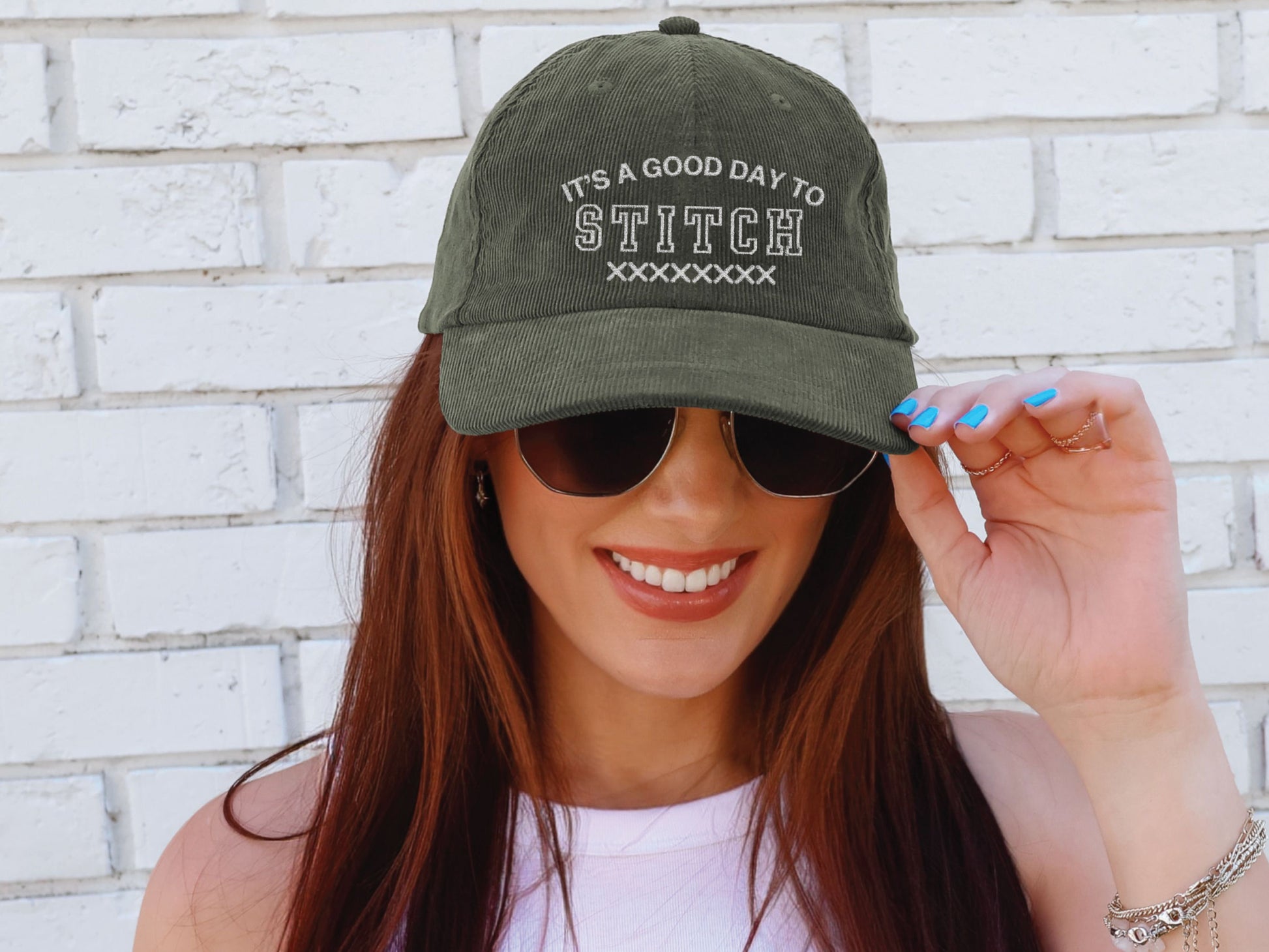 Vintage corduroy hat embroidered with the phrase “It’s a Good Day to Stitch,” shown in multiple color options—an ideal gift for cross stitch, embroidery, and needlework lovers.