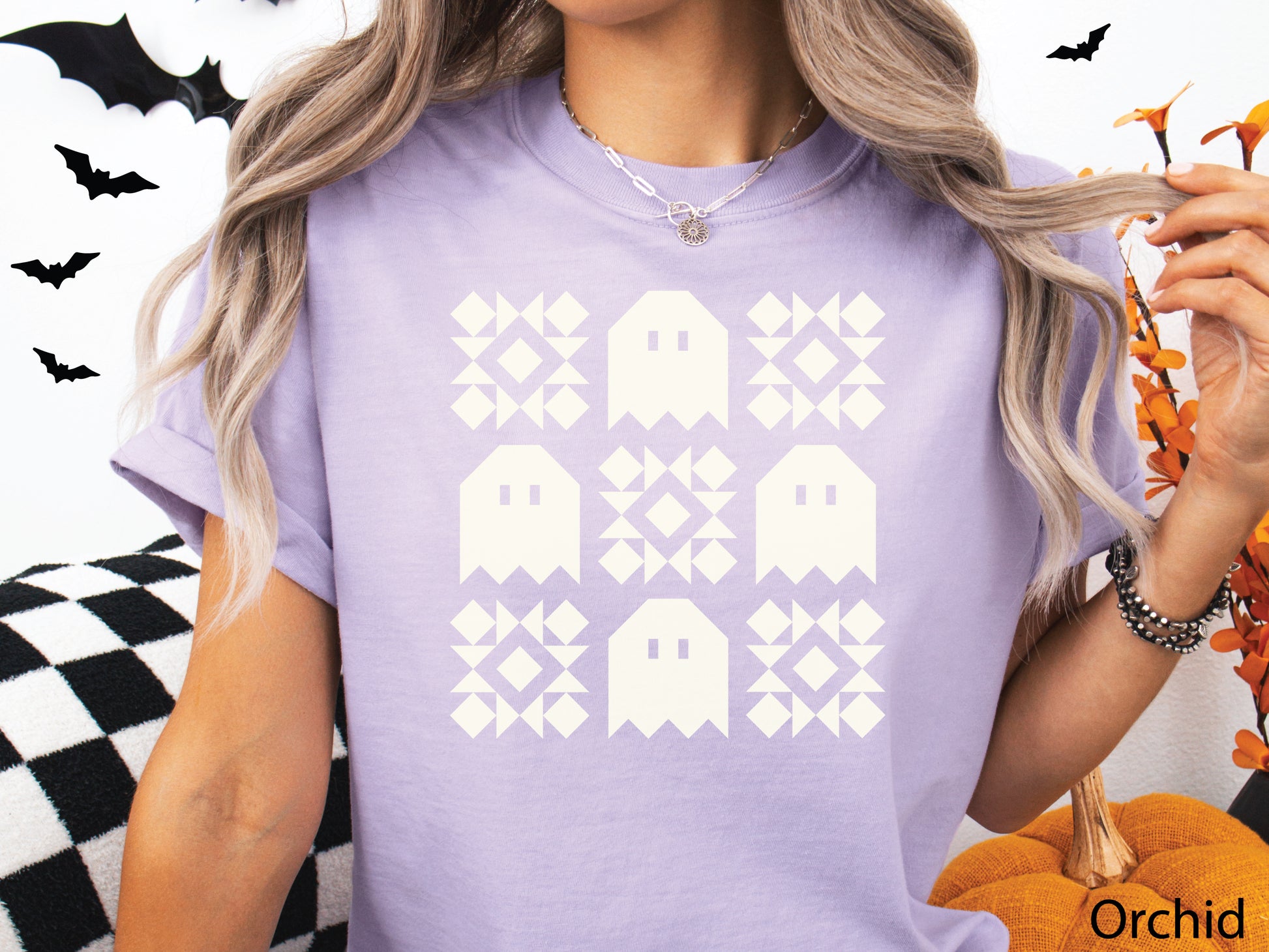 Halloween quilt t-shirt in Comfort Colors Orchid (light purple) orange with spooky ghost quilt blocks in a grid design—fun fall gift for quilters.