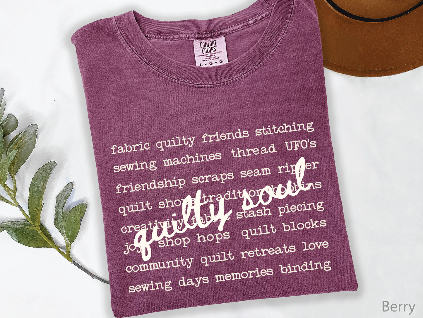 Vintage-inspired Quilty Soul t-shirt featuring a typewriter-style mix of quilting words with flowing handwritten script, perfect for quilters, everyday wear, quilt retreats, Halloween, and spooky season.
