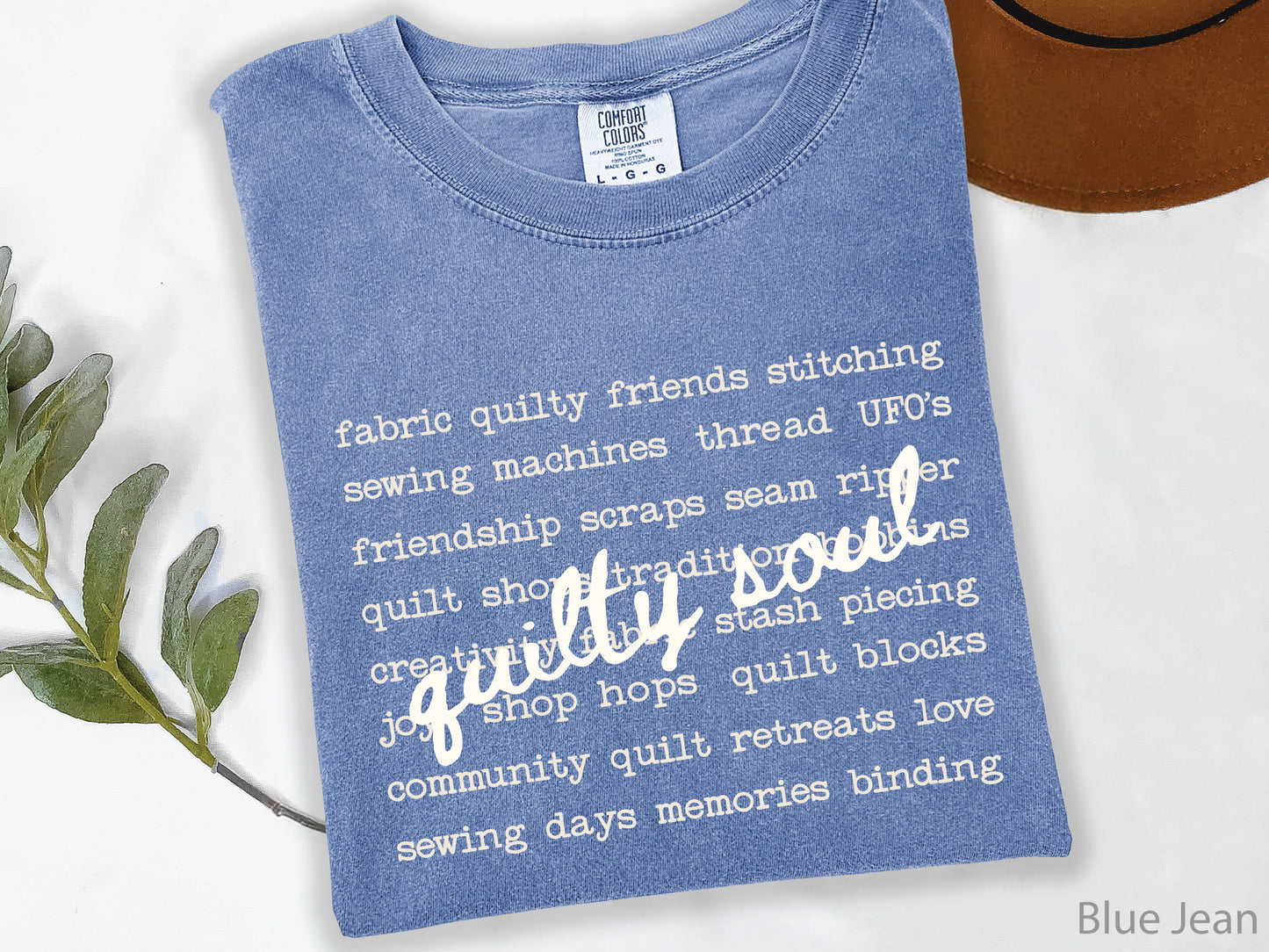 Vintage-inspired Quilty Soul t-shirt featuring a typewriter-style mix of quilting words with flowing handwritten script, perfect for quilters, everyday wear, quilt retreats, Halloween, and spooky season.