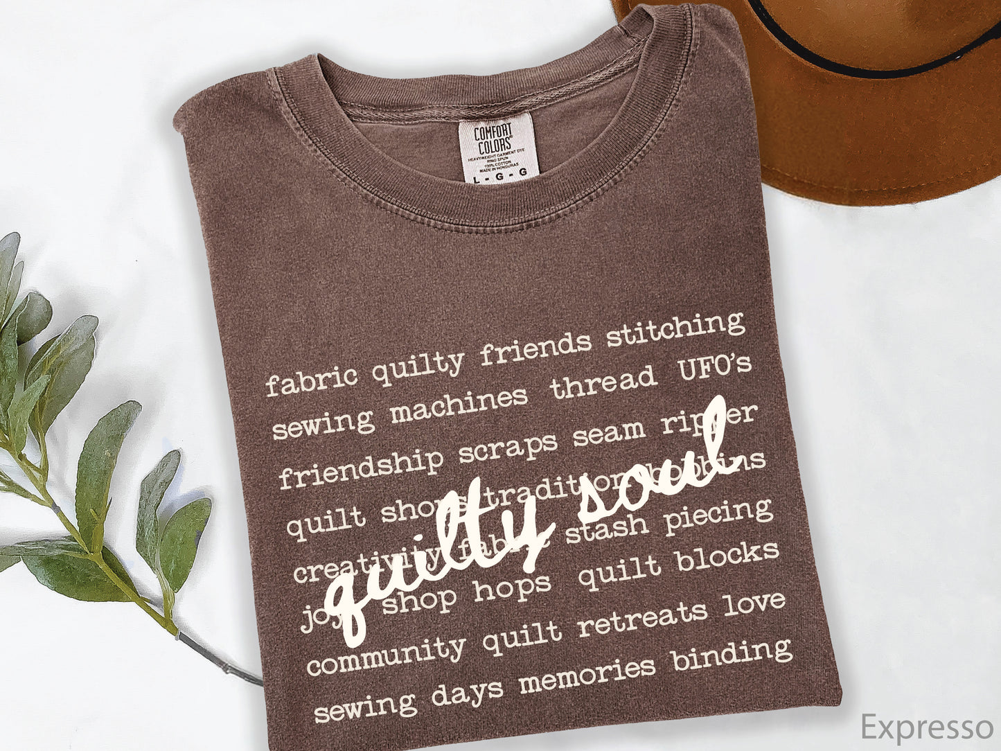 Vintage-inspired Quilty Soul t-shirt featuring a typewriter-style mix of quilting words with flowing handwritten script, perfect for quilters, everyday wear, quilt retreats, Halloween, and spooky season.
