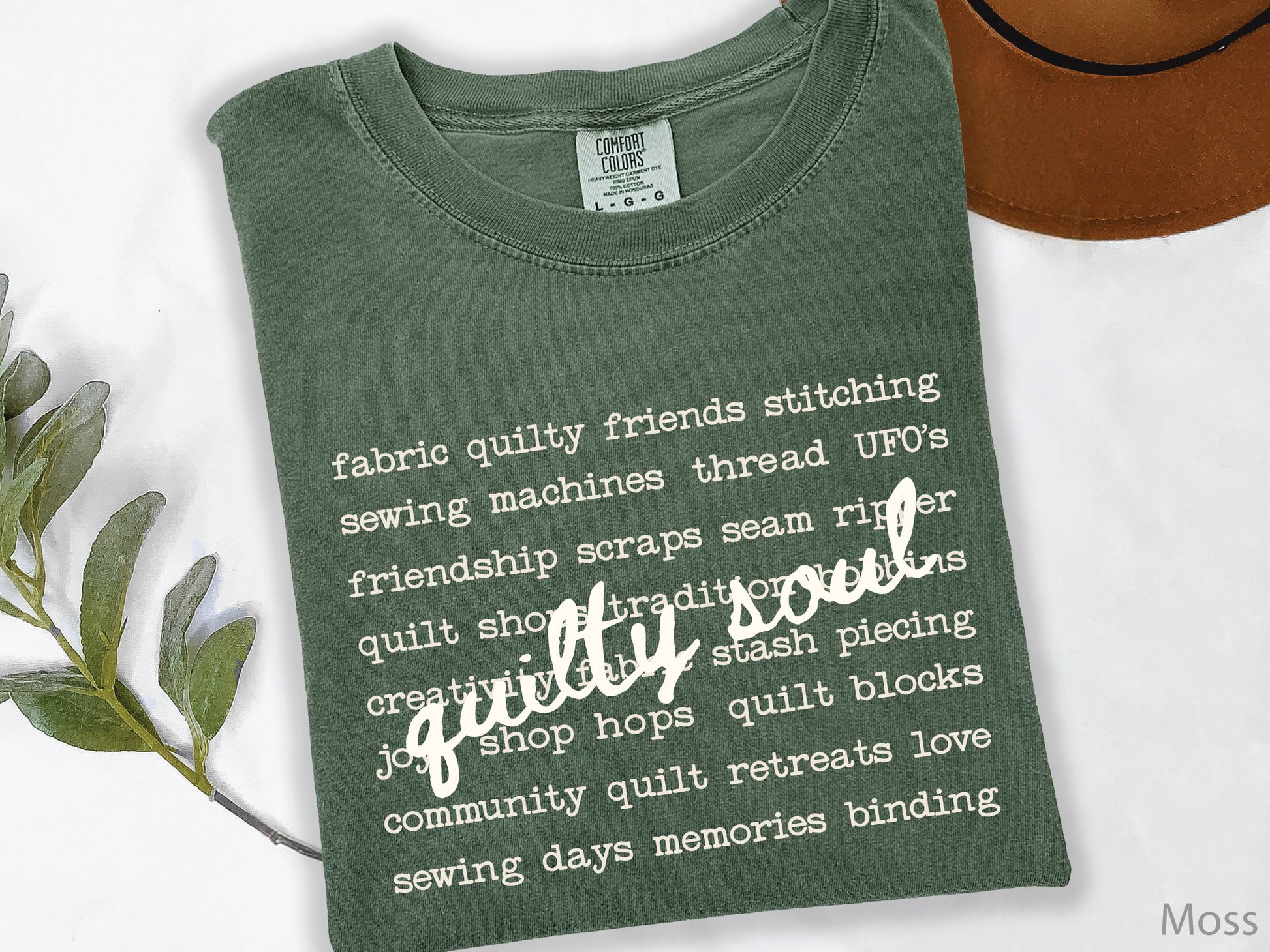 Vintage-inspired Quilty Soul t-shirt featuring a typewriter-style mix of quilting words with flowing handwritten script, perfect for quilters, everyday wear, quilt retreats, Halloween, and spooky season.