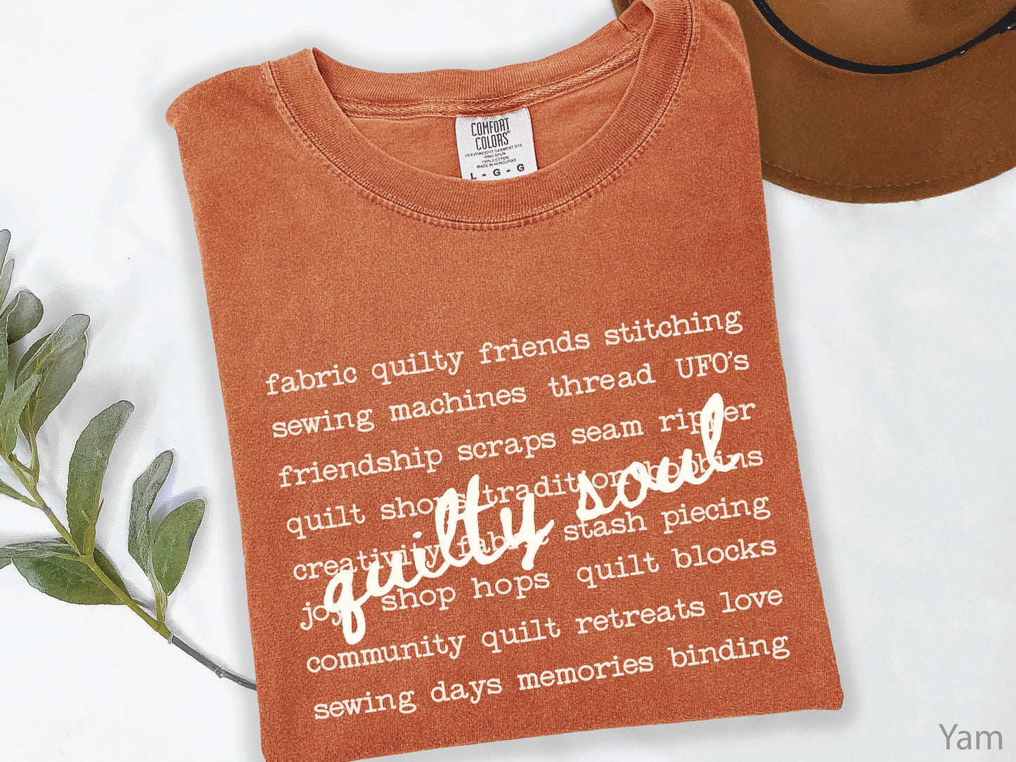 Vintage-inspired Quilty Soul t-shirt featuring a typewriter-style mix of quilting words with flowing handwritten script, perfect for quilters, everyday wear, quilt retreats, Halloween, and spooky season.