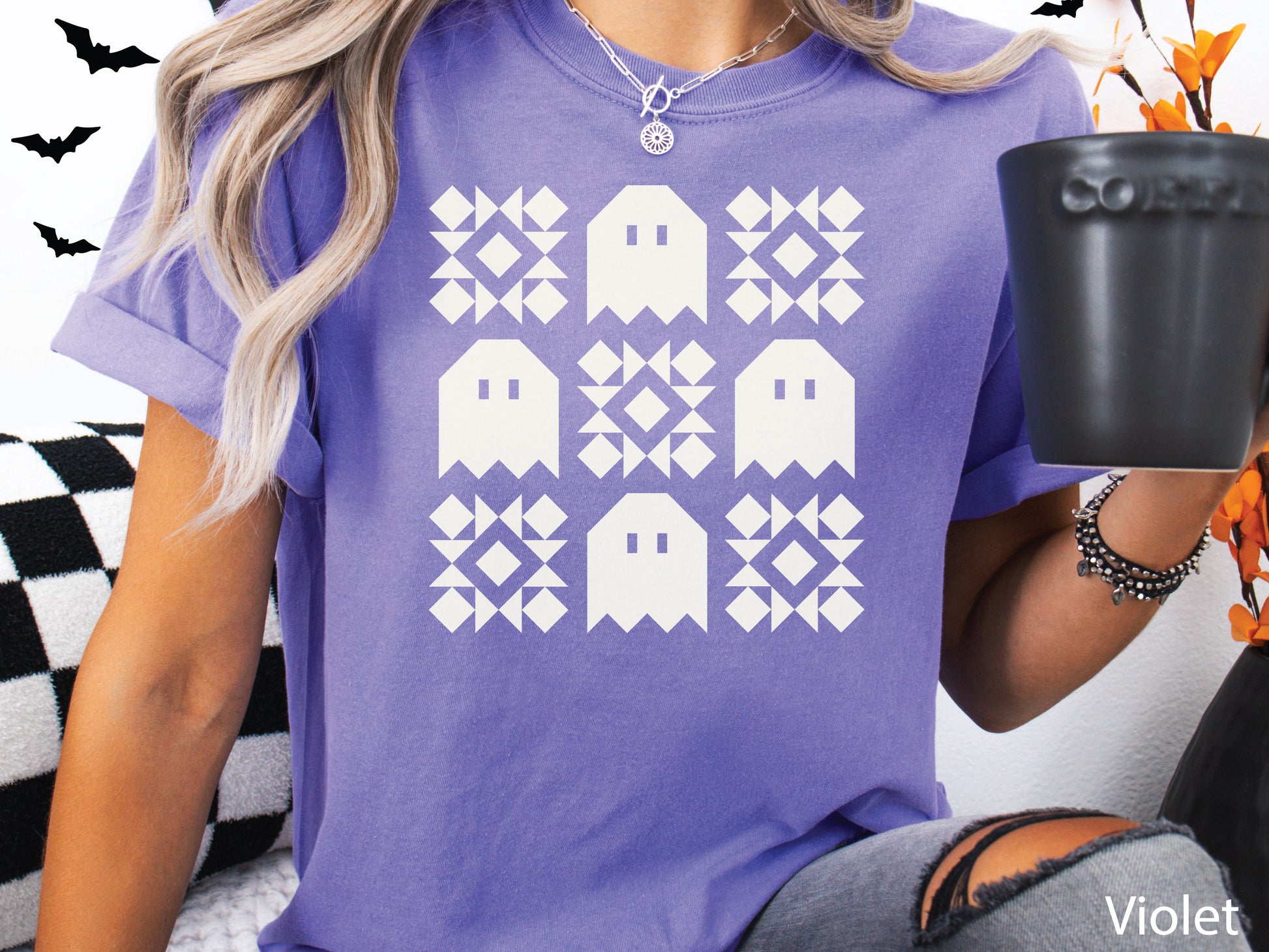 Halloween quilt t-shirt in Comfort Colors Violet orange with spooky ghost quilt blocks in a grid design—fun fall gift for quilters.