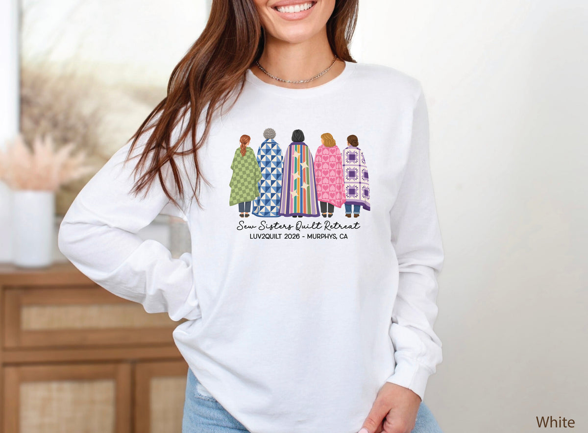 Sew Sisters Quilt Retreat long-sleeved shirt design featuring five women wrapped in colorful green, blue, striped, pink heart, and purple quilts with LUV2QUILT 2026 personalized text.
