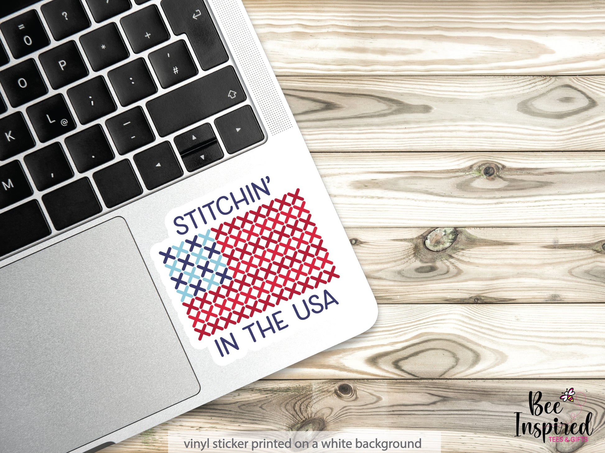 Patriotic “Stitchin’ In The USA” vinyl sticker with American flag stitching design on a white background, perfect for sewing, cross stitch, and needlepoint lovers celebrating America’s 250th.