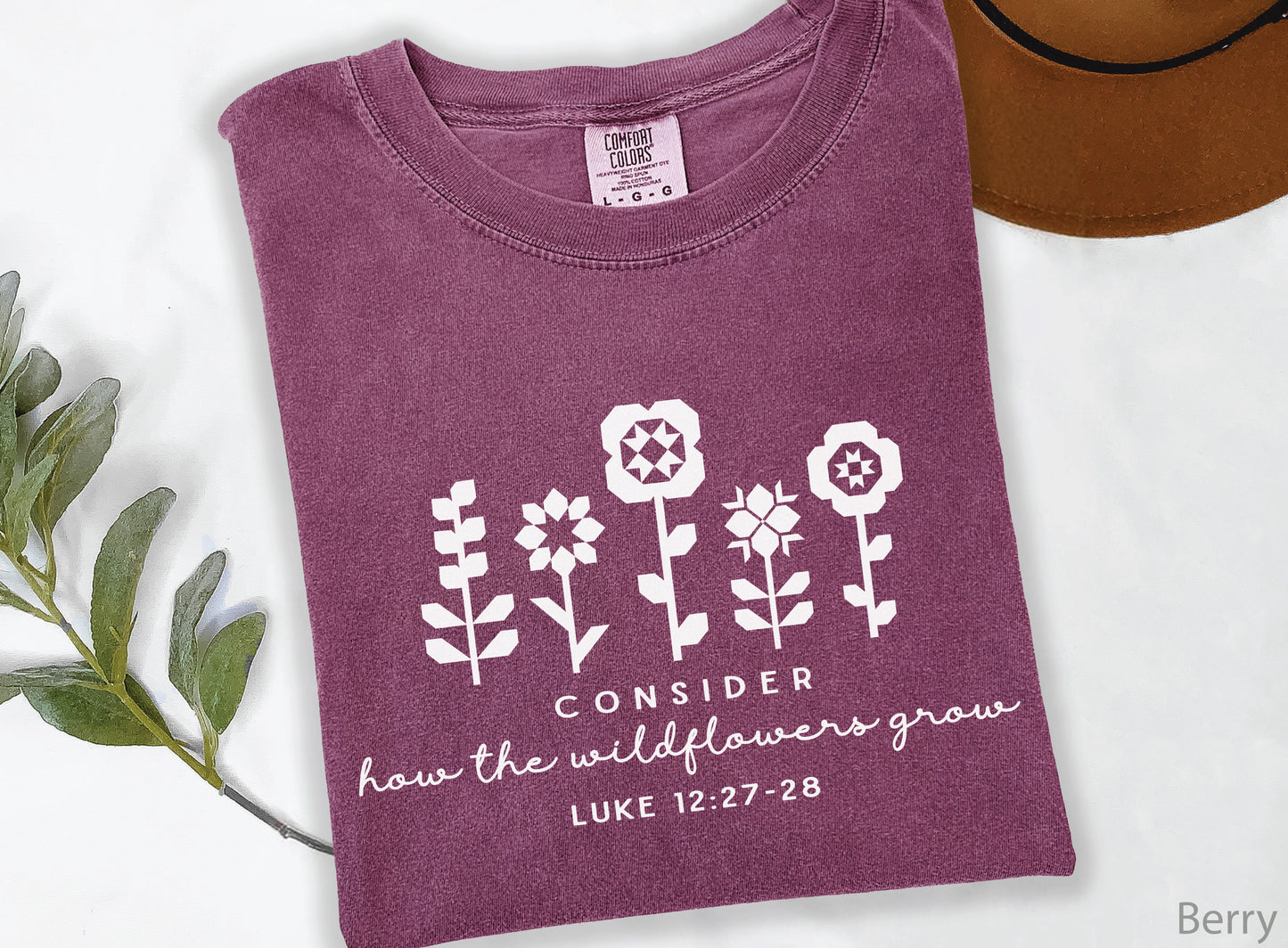 Quilt-inspired wildflower design t-shirt featuring Bible verse Luke 12:27–28, perfect for quilters and faith-based apparel.