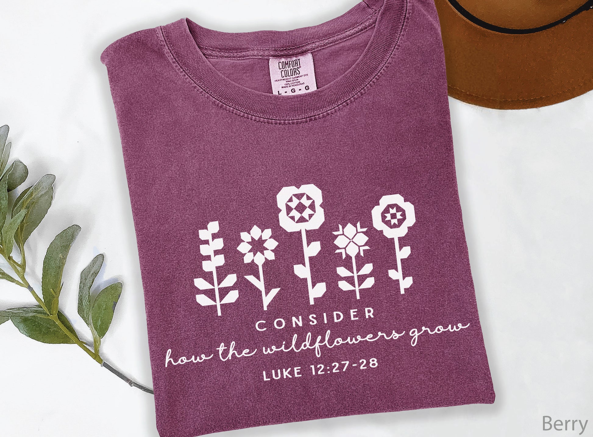 Quilt-inspired wildflower design t-shirt featuring Bible verse Luke 12:27–28, perfect for quilters and faith-based apparel.