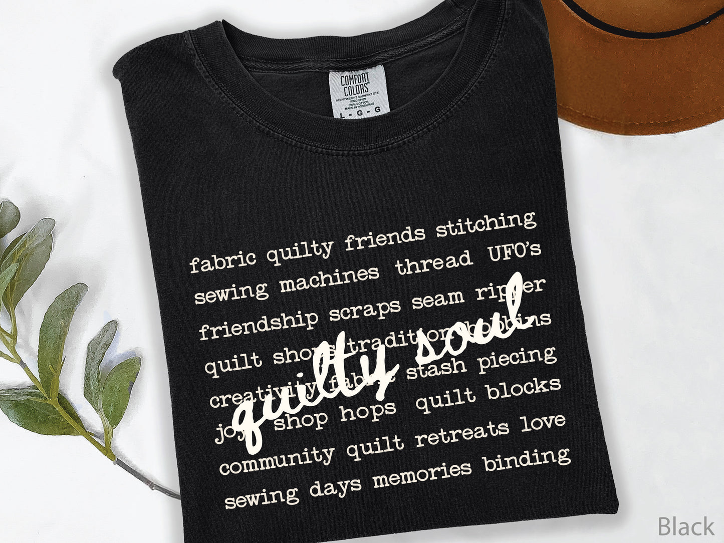 Vintage-inspired Quilty Soul t-shirt featuring a typewriter-style mix of quilting words with flowing handwritten script, perfect for quilters, everyday wear, quilt retreats, Halloween, and spooky season.
