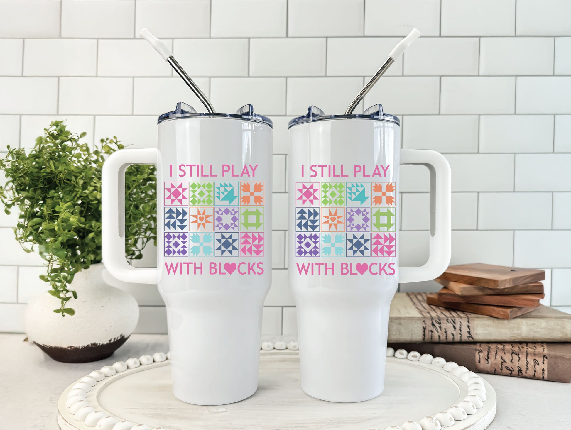 40oz tumbler with “I Still Play With Blocks,” decorated with colorful quilt blocks and a quilt-heart design; comes individually boxed for gifting.