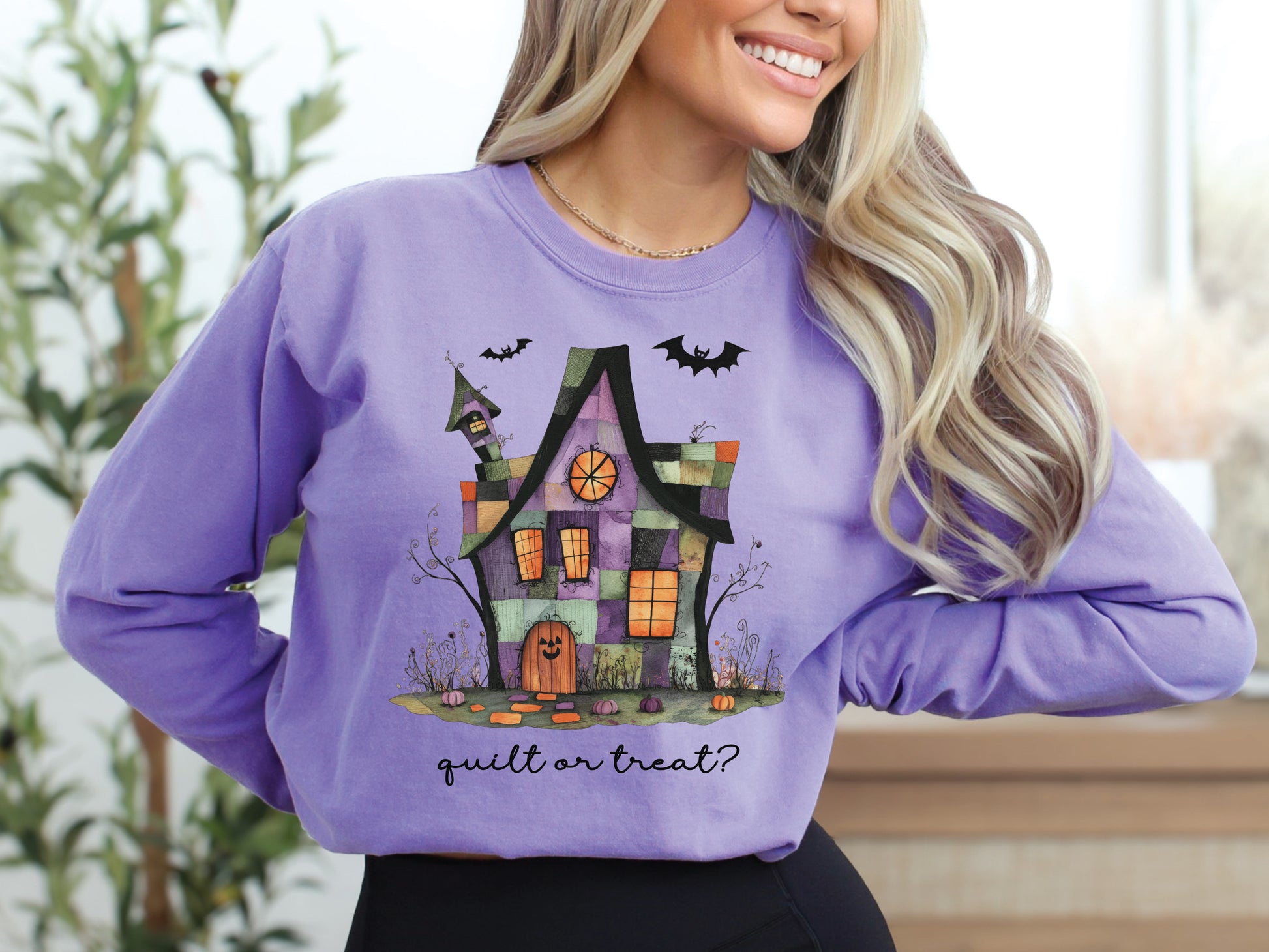 Quilt or Treat Halloween t-shirt on a Comfort Colors Violet tee—fun Halloween gift for quilters, perfect for spooky season sewing and retreats.