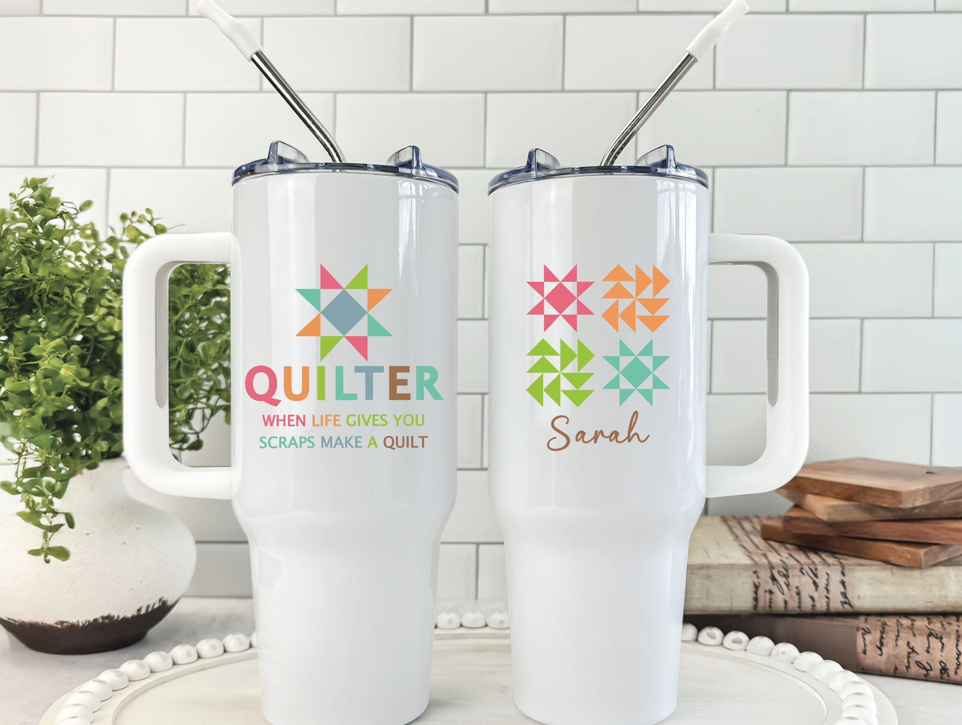 40oz handled tumbler featuring a bright quilt block star, the phrase “Quilter — When Life Gives You Scraps, Make a Quilt,” and colorful quilt blocks on the opposite side, personalize with name.