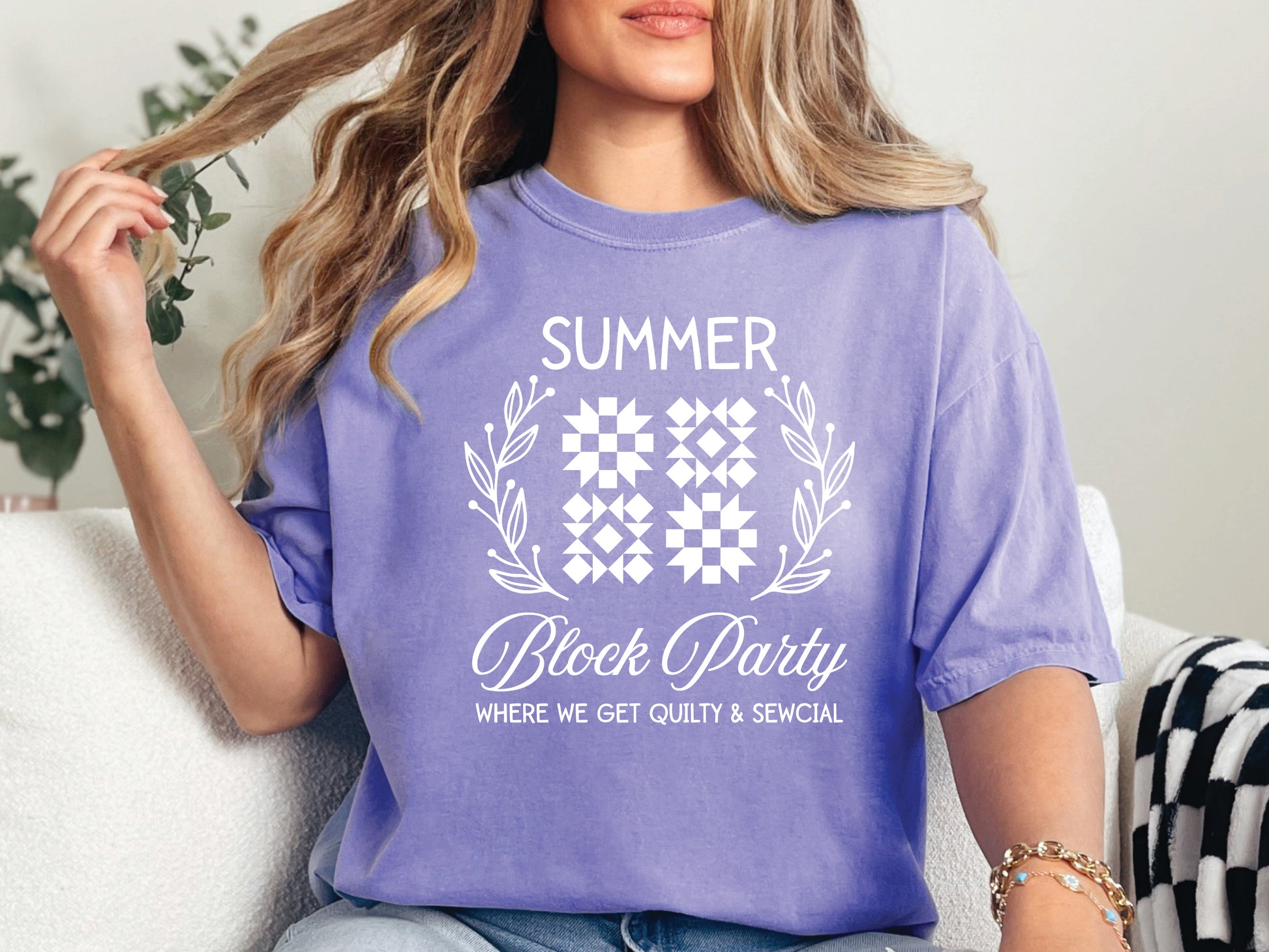 Summer quilt block t-shirt with the phrase “Where We Get Quilty & Sewcial,” a fun gift for quilters and sewists. Perfect for retreats, sew days, and summer stitching sessions.