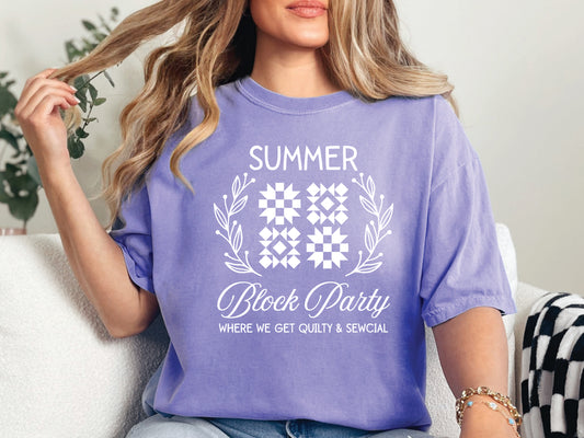 Summer quilt block t-shirt with the phrase “Where We Get Quilty & Sewcial,” a fun gift for quilters and sewists. Perfect for retreats, sew days, and summer stitching sessions.