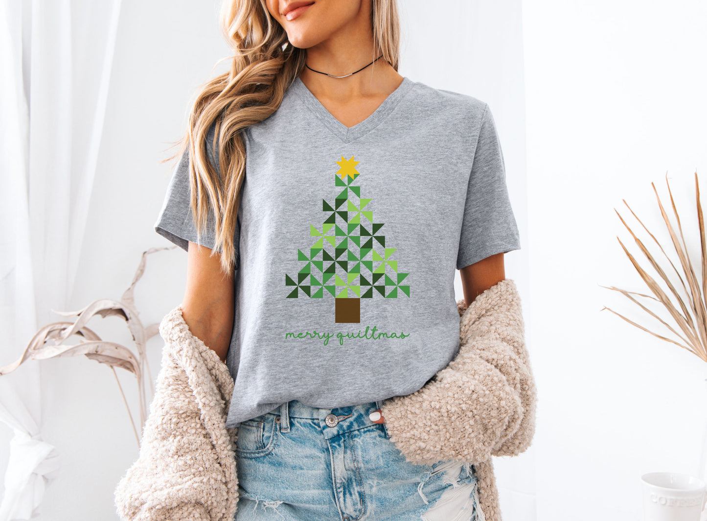 Quilting tee with a Merry Quiltmas design featuring a green pinwheel quilt-block Christmas tree topped with a gold star — festive holiday gift for quilters and sewists.