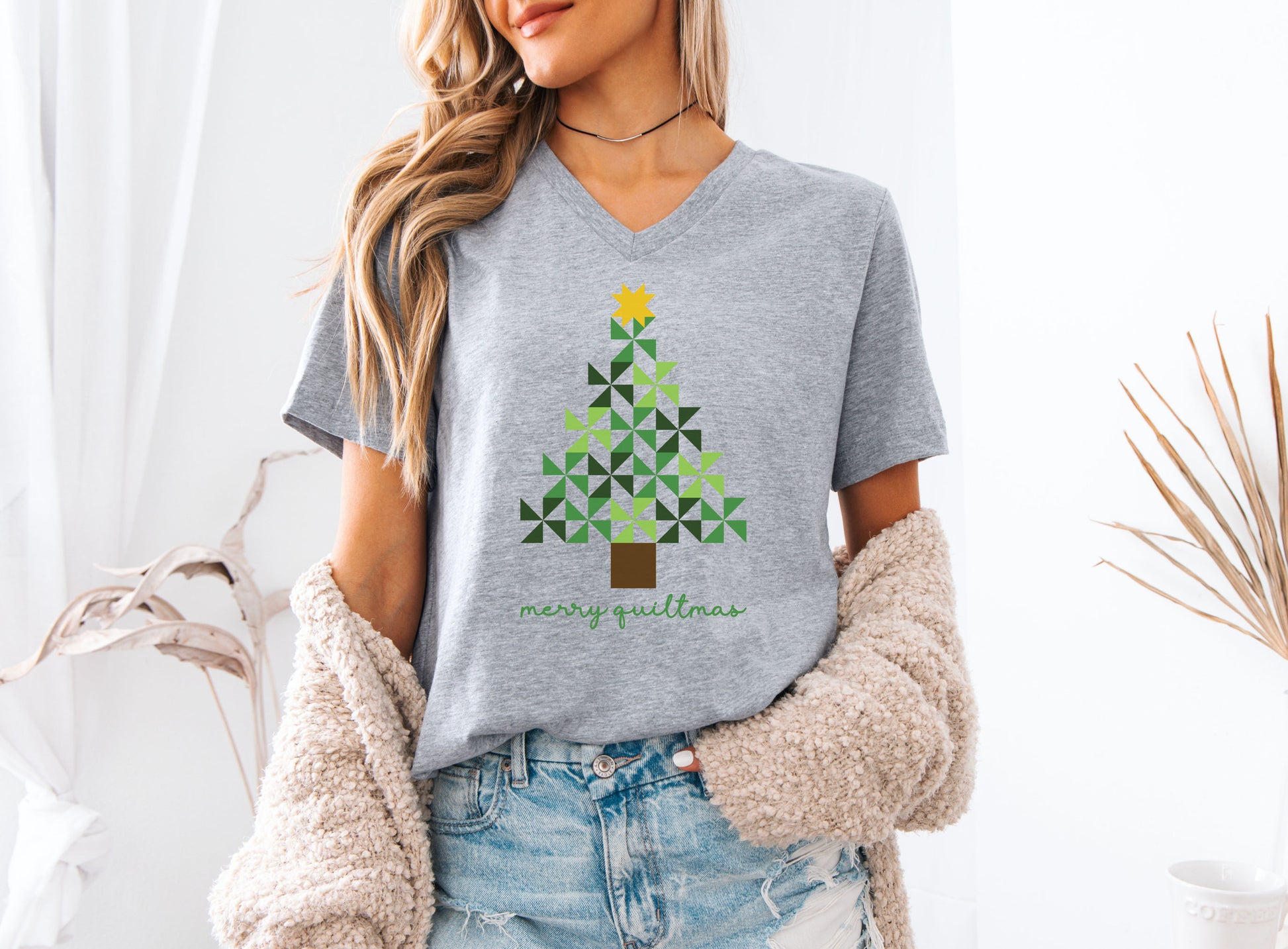 Quilting tee with a Merry Quiltmas design featuring a green pinwheel quilt-block Christmas tree topped with a gold star — festive holiday gift for quilters and sewists.