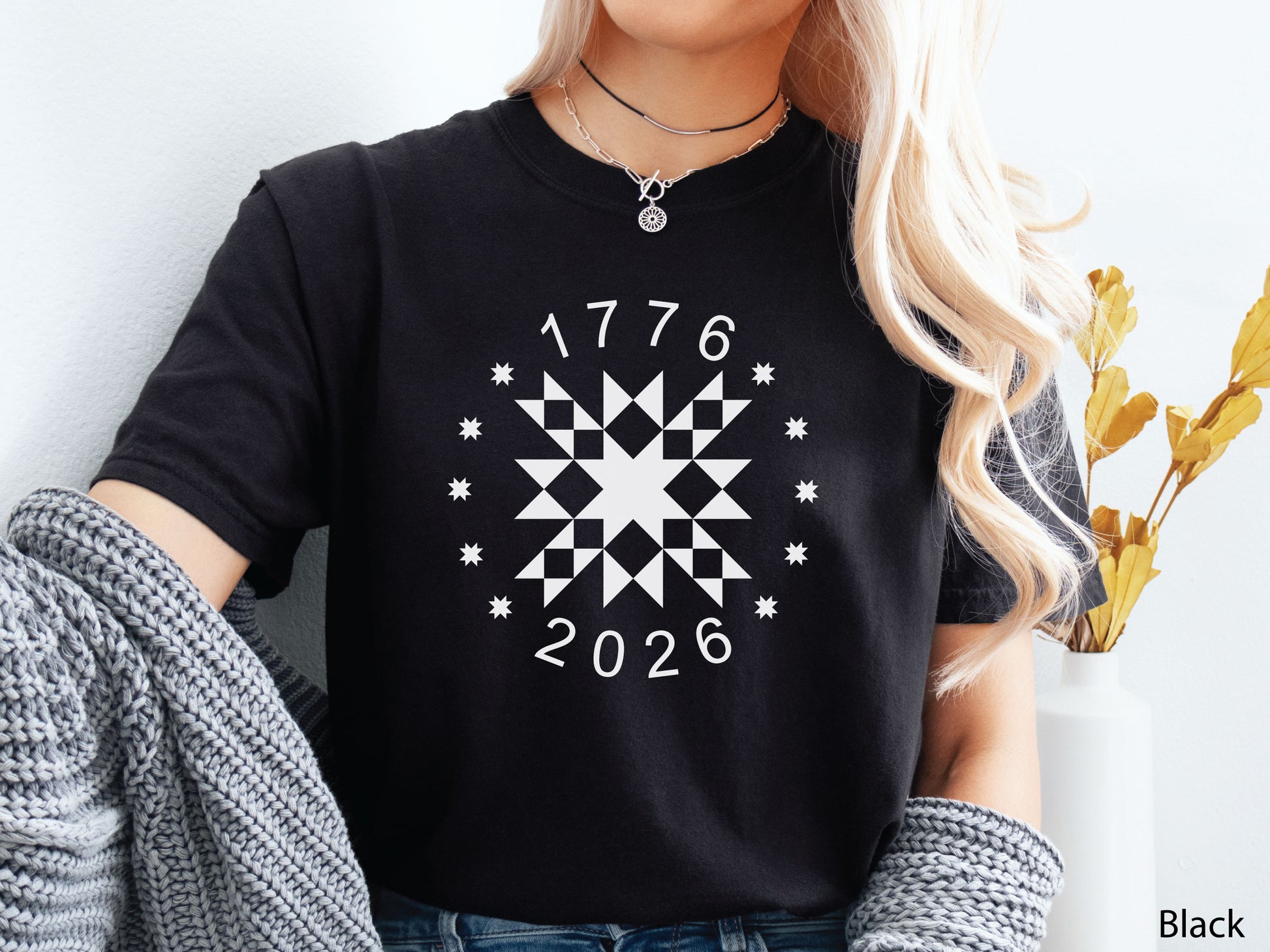 Patriotic quilting t-shirt in navy featuring a white star quilt block with surrounding stars and the years 1776–2026, celebrating America’s 250th Anniversary.